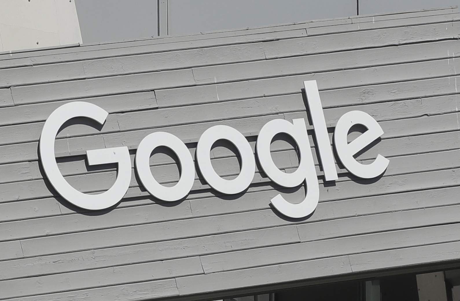 A Google sign is shown on the company campus in Mountain View, Calif., on Sept. 24, 2019. A former Google employee has sued the tech giant saying it engages in a “pattern and practice” of racial discrimination against its Black workers, steering them into lower-level and lower-paid jobs and subjecting them to a hostile work environment if they speak out. 