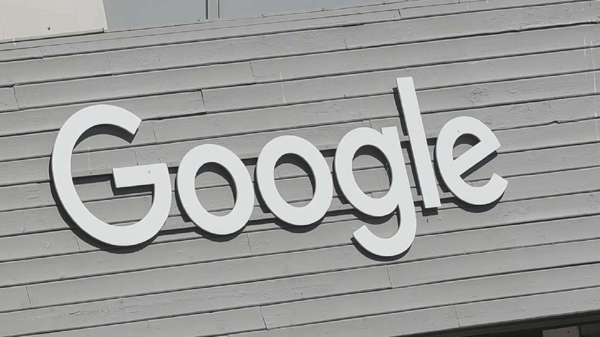 A Google sign is shown on the company campus in Mountain View, Calif., on Sept. 24, 2019. A former Google employee has sued the tech giant saying it engages in a “pattern and practice” of racial discrimination against its Black workers, steering them into lower-level and lower-paid jobs and subjecting them to a hostile work environment if they speak out.