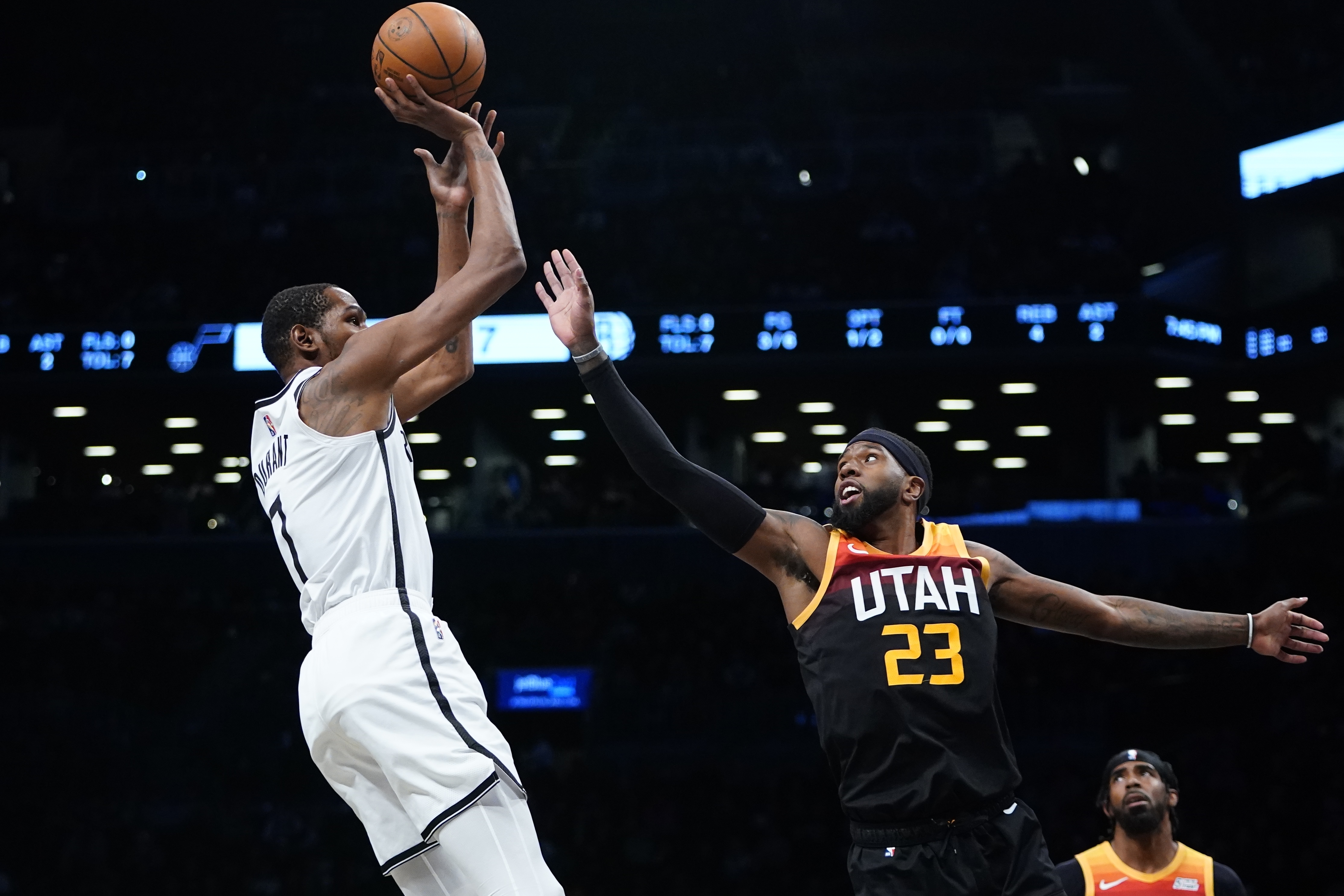 Brooklyn Nets' Kevin Durant (7) shoots over Utah Jazz's Royce O'Neale (23) during the first half of an NBA basketball game Monday, March 21, 2022, in New York.