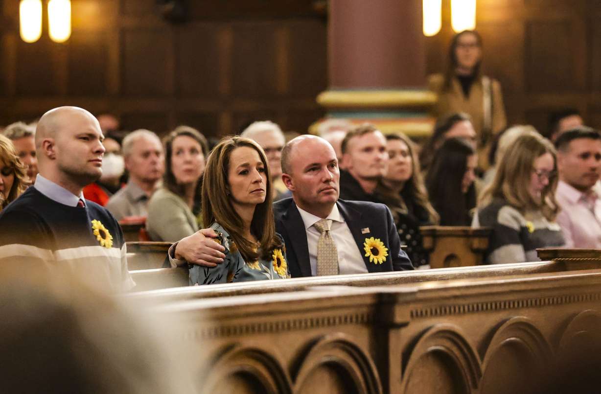 Utah Gov. Spencer Cox and first lady Abby Cox are pictured during a prayer at the Voices for Ukraine event at the Cathedral of the Madeleine in Salt Lake City on Monday.
