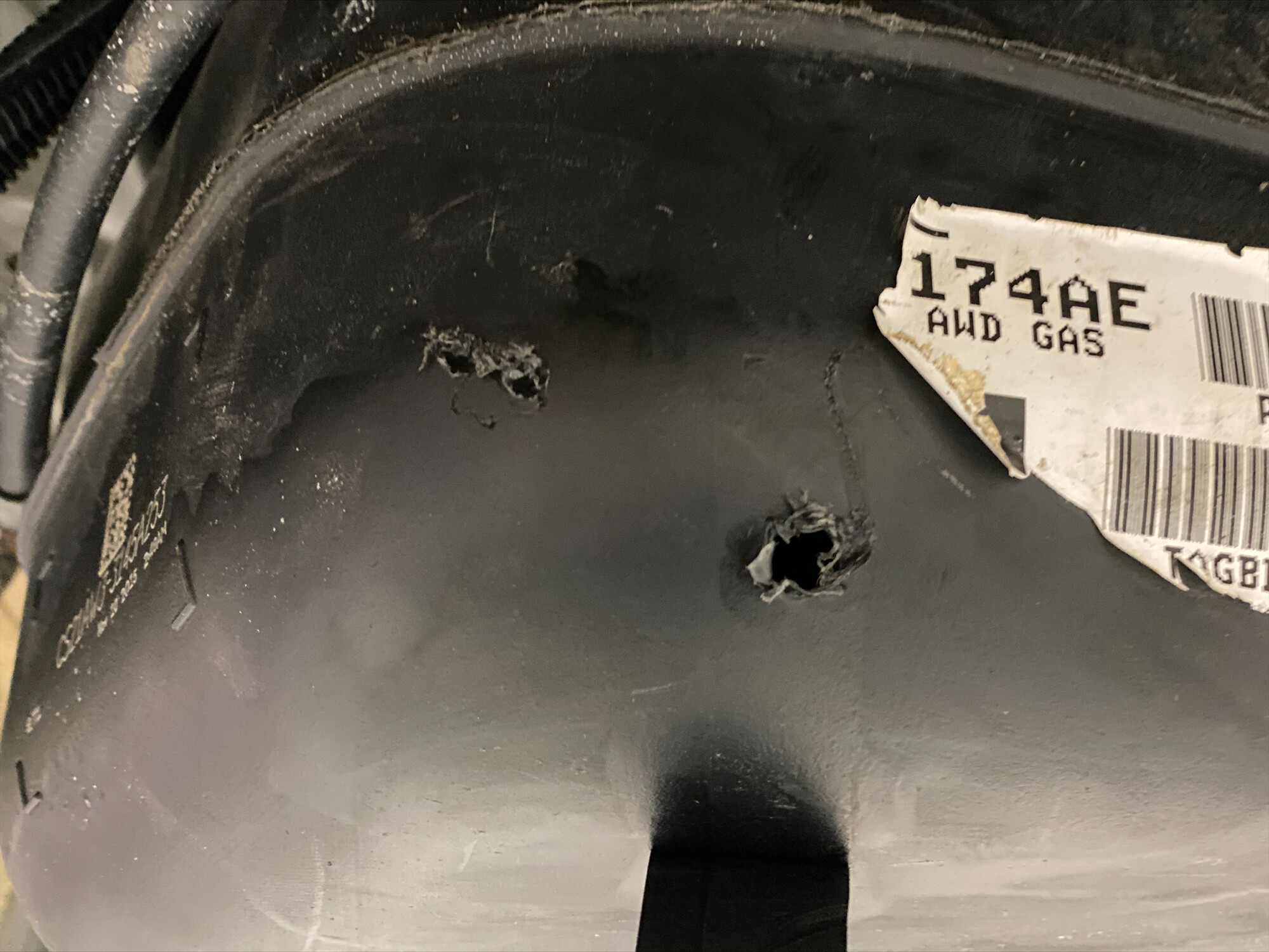 The damaged gas tank that Gross Auto Group employees discovered. Police departments nationwide are receiving reports of gas thefts from businesses, gas stations and individuals. 