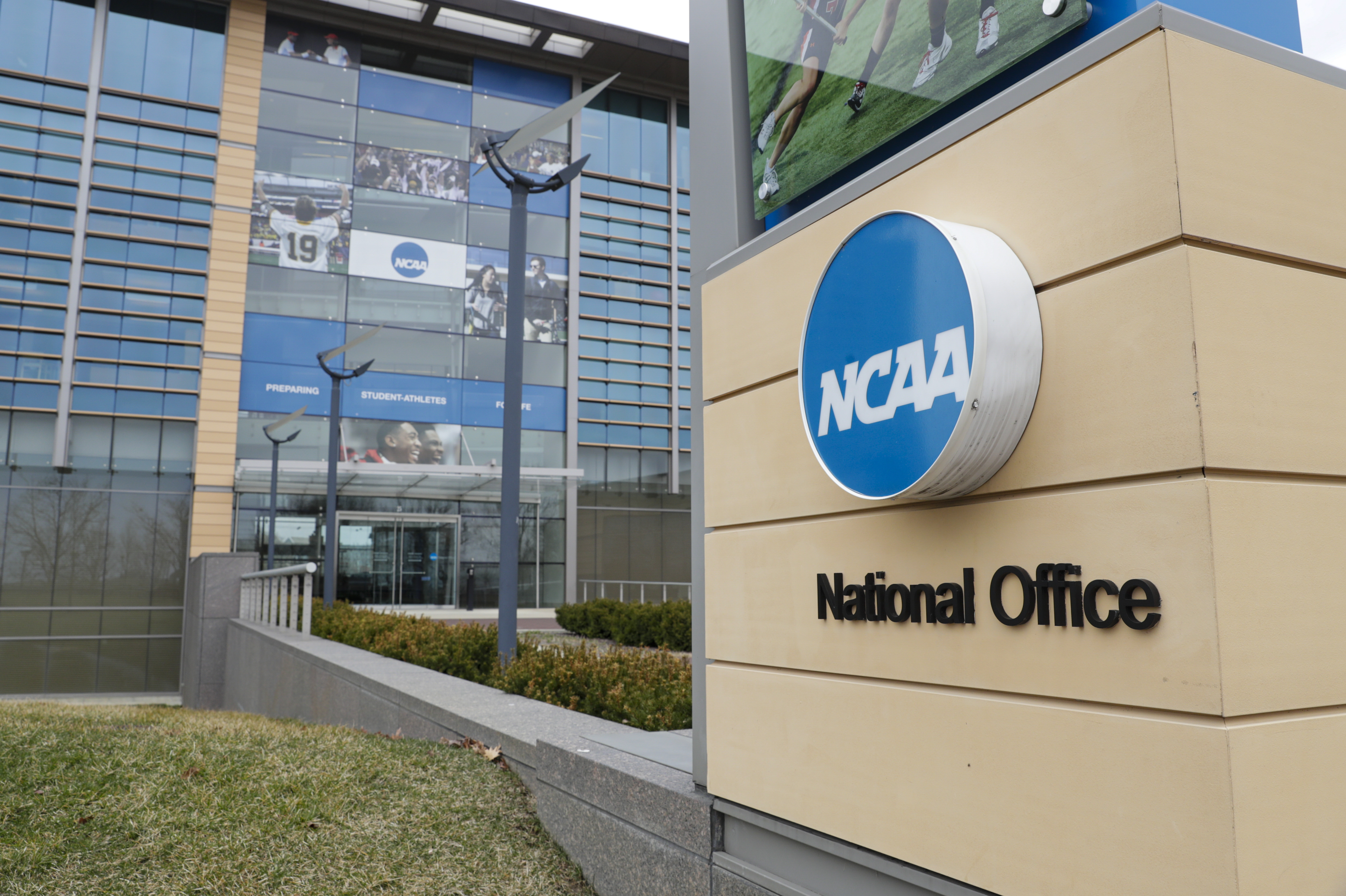 FILE - The NCAA headquarters in Indianapolis is shown in this March 12, 2020. A group that advocates for college athletes has filed a federal complaint that claims NCAA Division I schools are violating the civil rights of Black basketball players and major college football players by prohibiting compensation. The National College Players Association announced Tuesday, March 22, 2022 it had submitted a complaint to the Office for Civil Rights in the Education Department. 