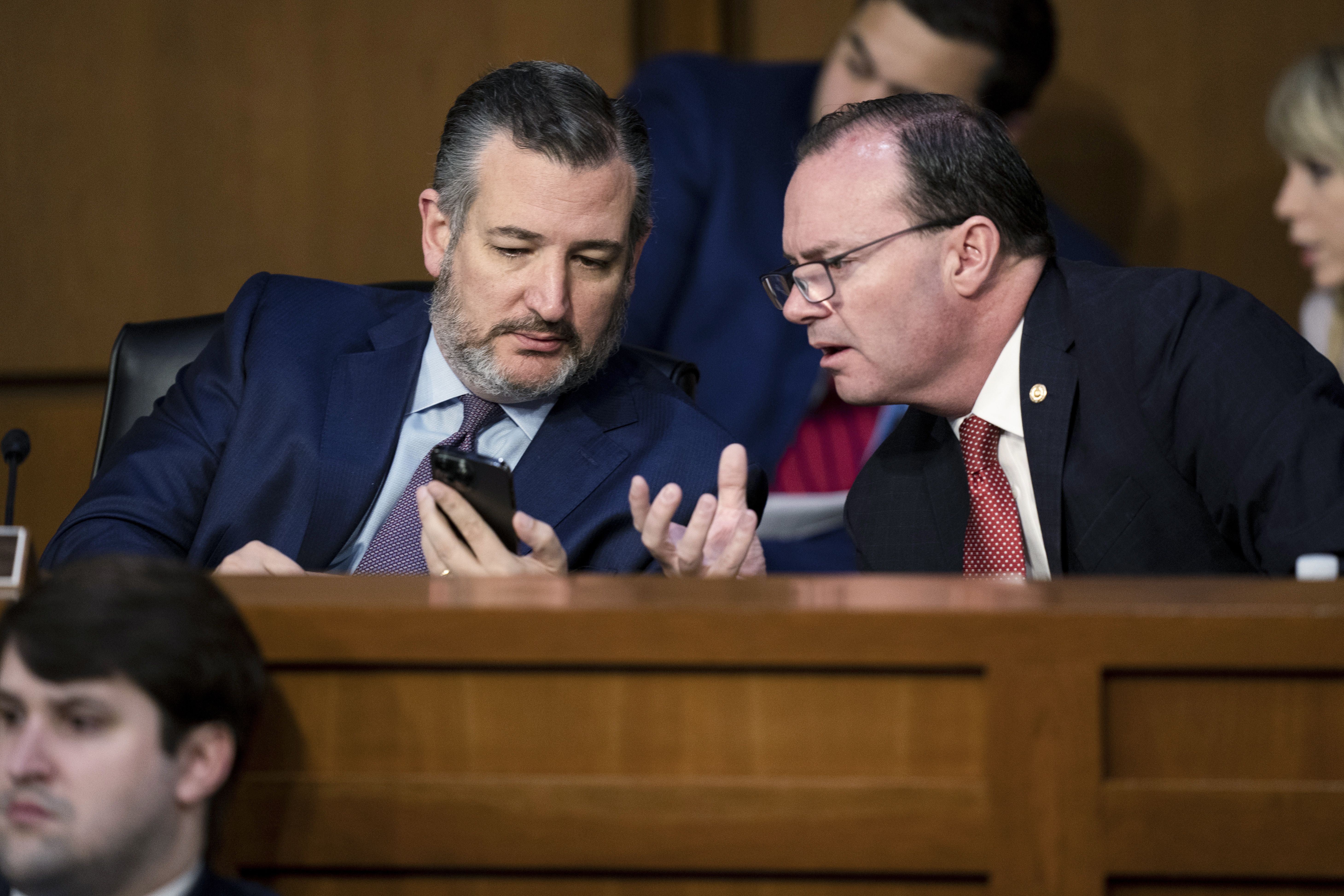 Sen. Ted Cruz, R-Texas, left, talks with Sen. Mike Lee, R-Utah, during a confirmation hearing for Supreme Court nominee Ketanji Brown Jackson before the Senate Judiciary Committee, Tuesday, in Washington. Sen. Mike Lee says some want to know where Judge Jackson stands on expanding the size of the Supreme Court.