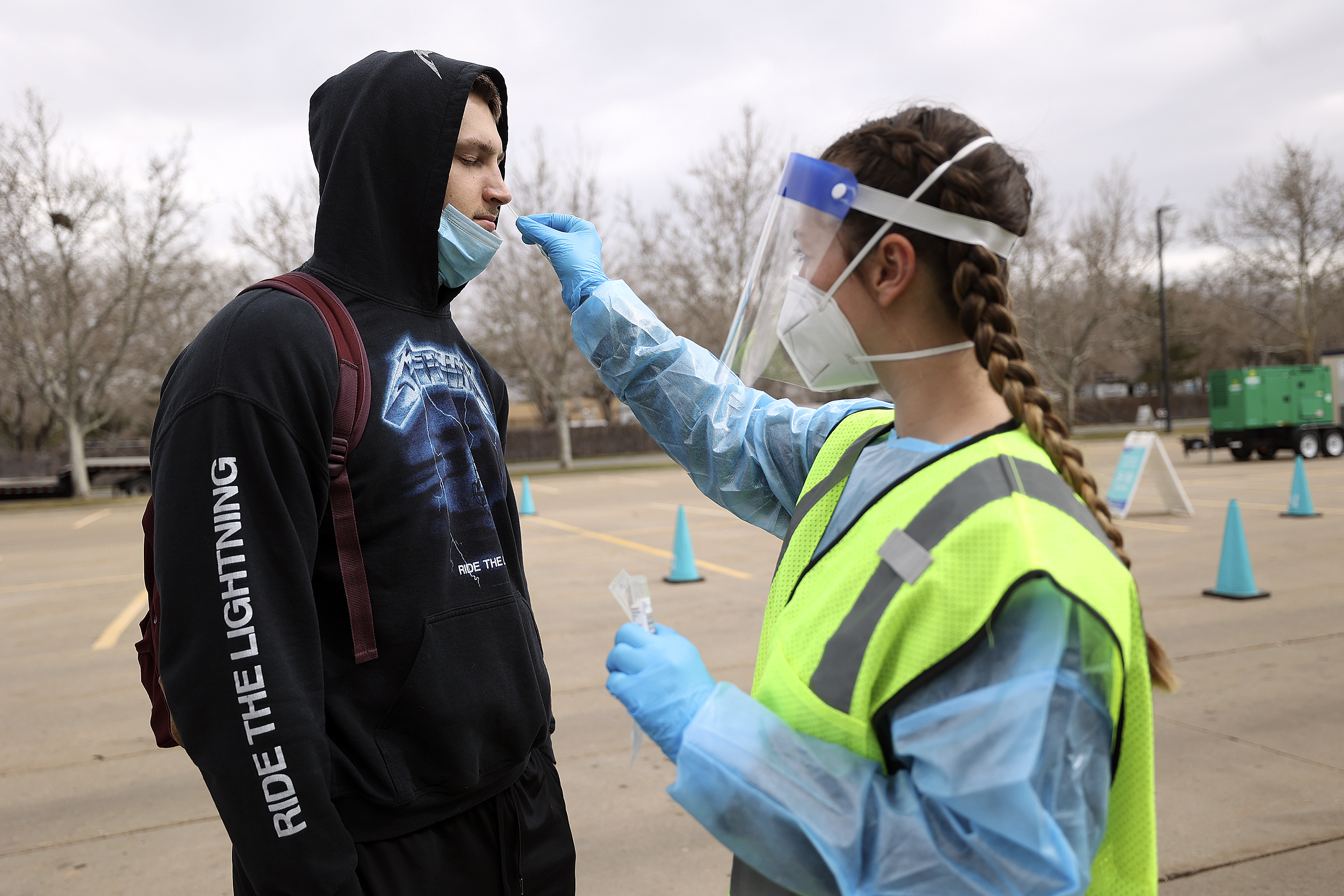 Nurse Megan Christley swabs Mason Stoup’s nose for a COVID-19 test at a Nomi Health testing site outside of the Utah Department of Health building in Salt Lake City on March 16. On Thursday, Utah health officials reported 5,150 new COVID-19 cases and 28 additional deaths over the past week.