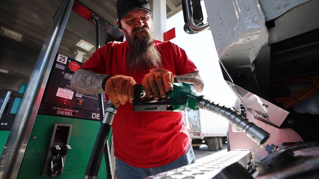 John Reese, a driver for Jets Logistics, fills one of his semitruck’s tanks in Salt Lake City on Tuesday.