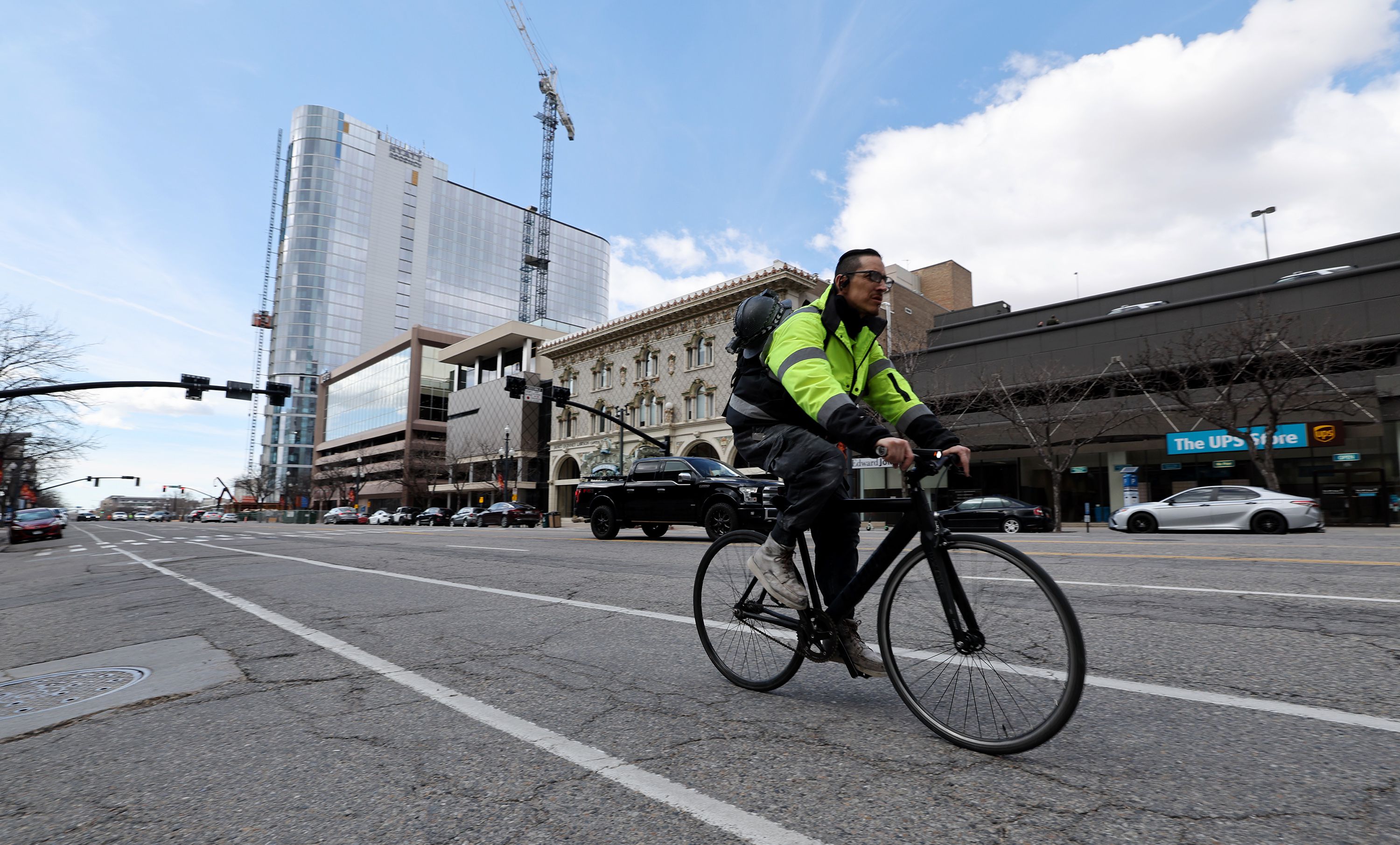 A cyclist rides east on 200 South in Salt Lake City on Tuesday.