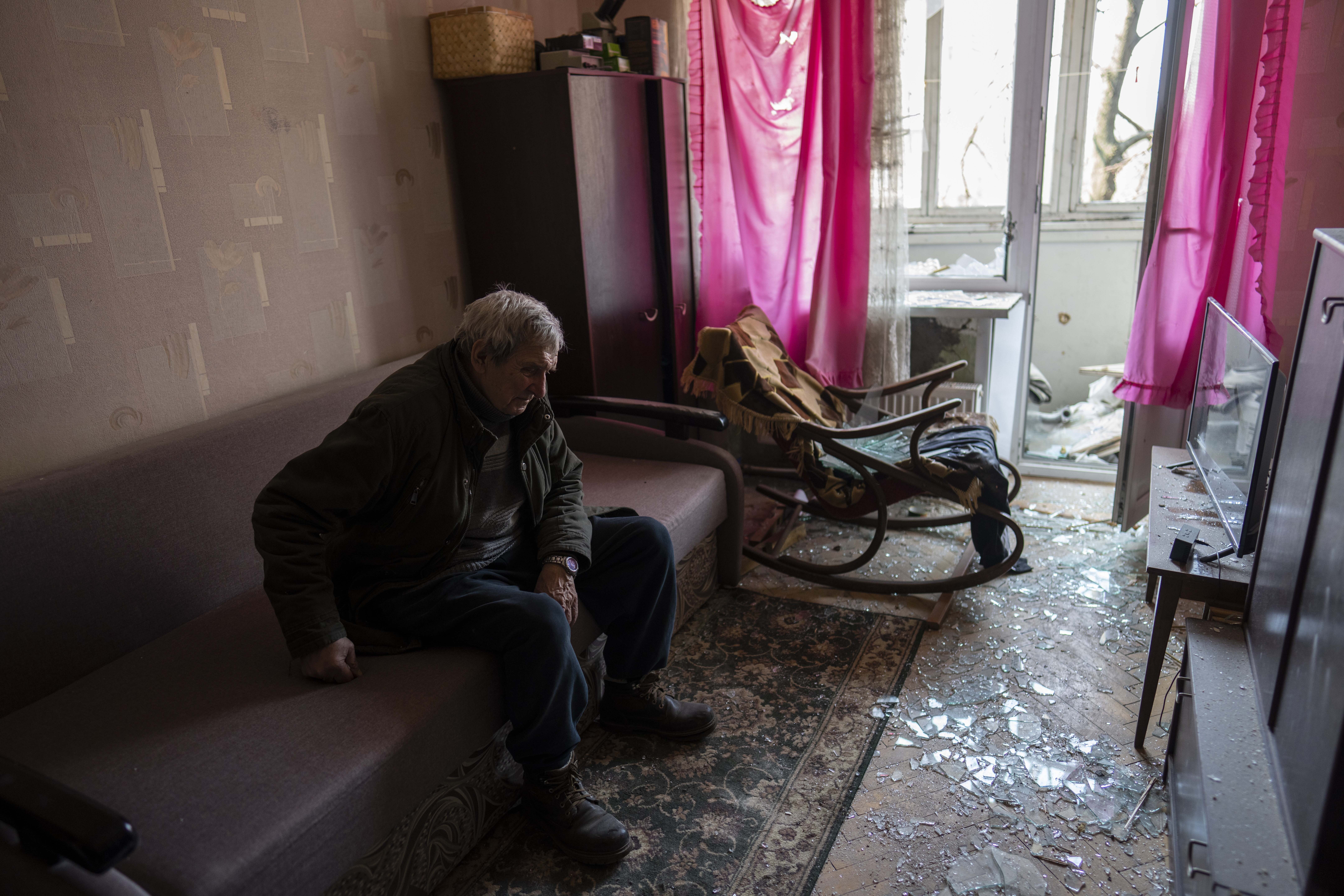 Volodymyr, 80, rests inside his apartment damaged by shelling, in Kyiv, Ukraine, on Wednesday.