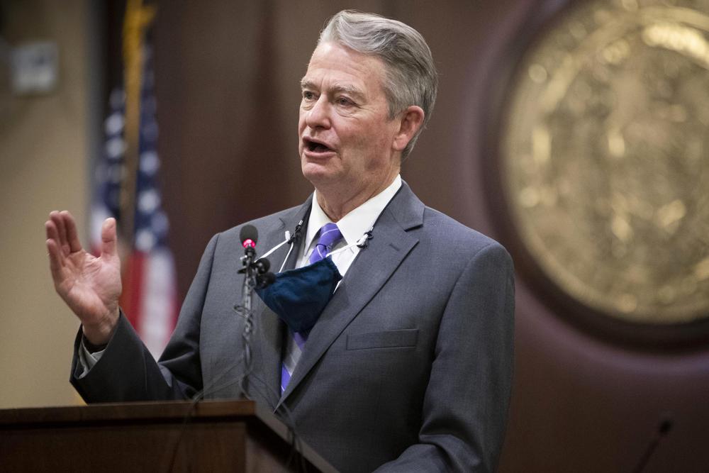 In this Oct. 1, 2020 photo, Idaho Gov. Brad Little speaks during a press conference at the Statehouse in Boise, Idaho. Idaho on Wednesday became the first state to enact a law modeled after a Texas statute banning abortions after about six weeks of pregnancy and allowing it to be enforced through civil lawsuits to avoid constitutional court challenges.