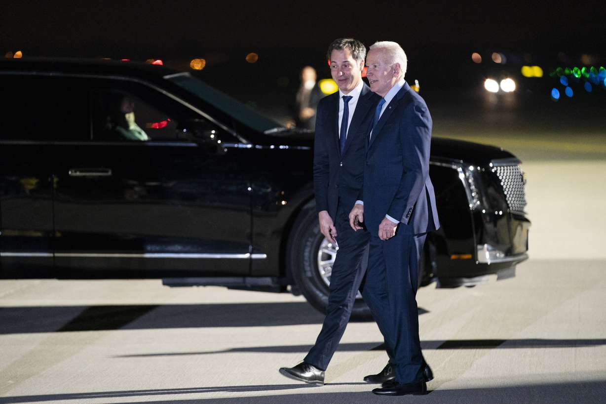 President Joe Biden is greeted by Belgian Prime Minister Alexander de Croo after arriving at Brussels National Airport, Wednesday, in Brussels.