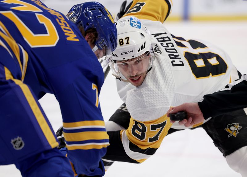 Mar 23, 2022; Buffalo, New York, USA;  The linesman drops the puck for a face-off between Buffalo Sabres right wing Tage Thompson (72) and Pittsburgh Penguins center Sidney Crosby (87) during the first period at KeyBank Center.