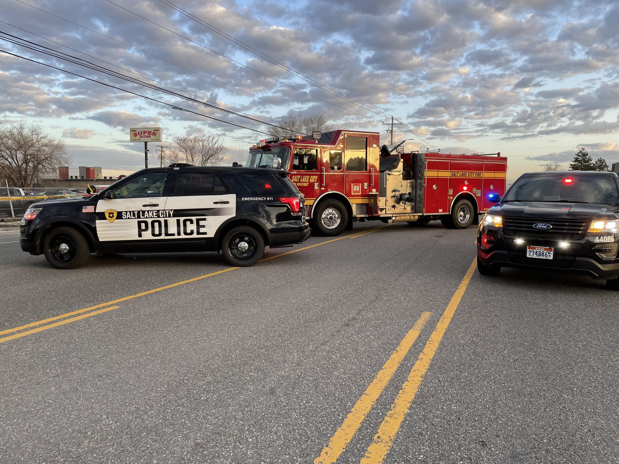 Salt Lake City police respond to the scene of a double fatal crash at 980 S. Redwood Road on Thursday. Investigators say a van hit head-on with a garbage truck.