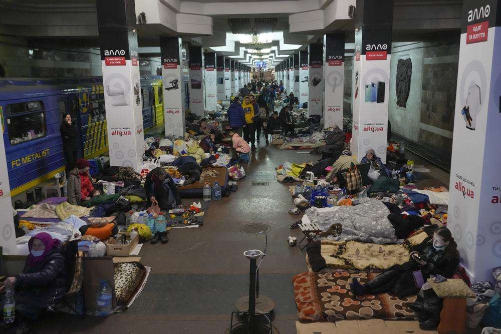 People with their belongings in a city subway that they have used as a bomb shelter in Kharkiv, Ukraine, Thursday. Ukraine accused Moscow on Thursday of forcibly taking thousands of civilians from the shattered port city of Mariupol to Russia so that they can be used as "hostages" to pressure Kyiv to give up.