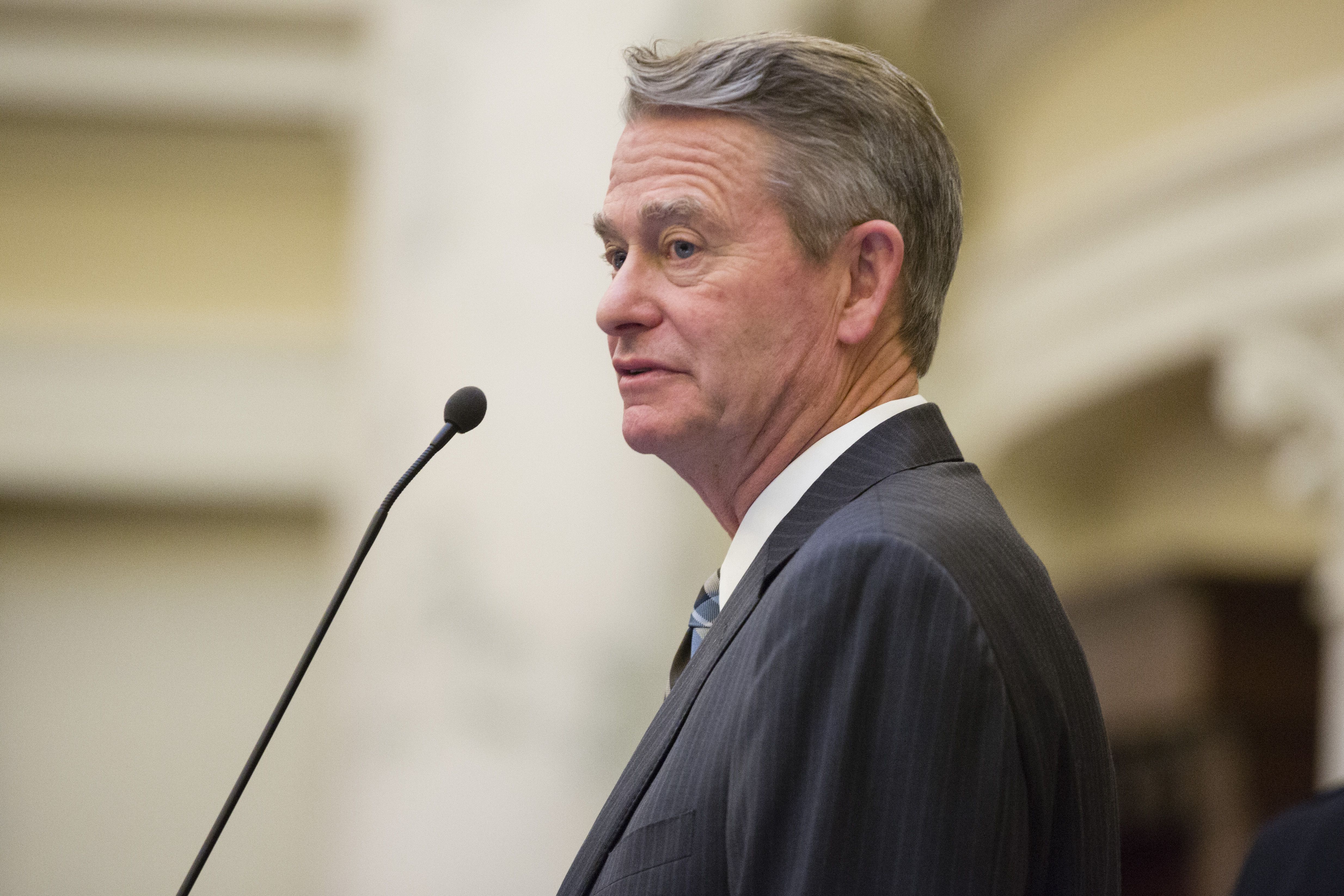 Idaho Gov. Brad Little watches the proceedings before the State of the State address inside the House chambers at the state Capitol in Boise, Idaho, on Jan. 9, 2017. Gov. Brad Little on Wednesday signed the Idaho Legislature's Texas-style abortion bill into law, making the Western state the first state to follow in Texas' footsteps to ban abortions after about six weeks of pregnancy.