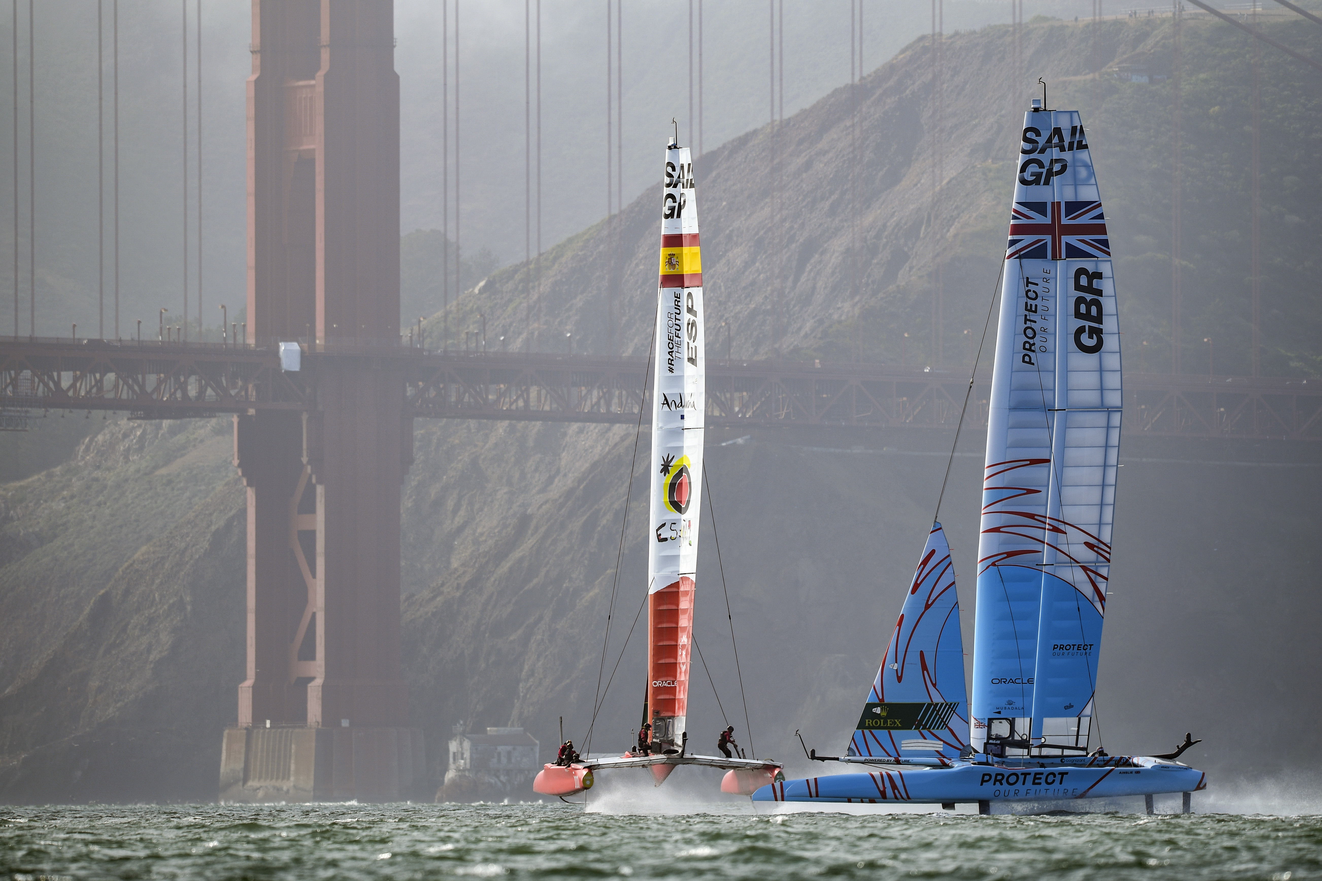 In this image provided by SailGP, Britain's SailGP Team, right, helmed by Ben Ainslie, crosses paths with Spain SailGP Team co-helmed by Florian Trittel and Jordi Xammar during a practice session ahead of San Francisco SailGP in San Francisco, Wednesday, March 23, 2022.