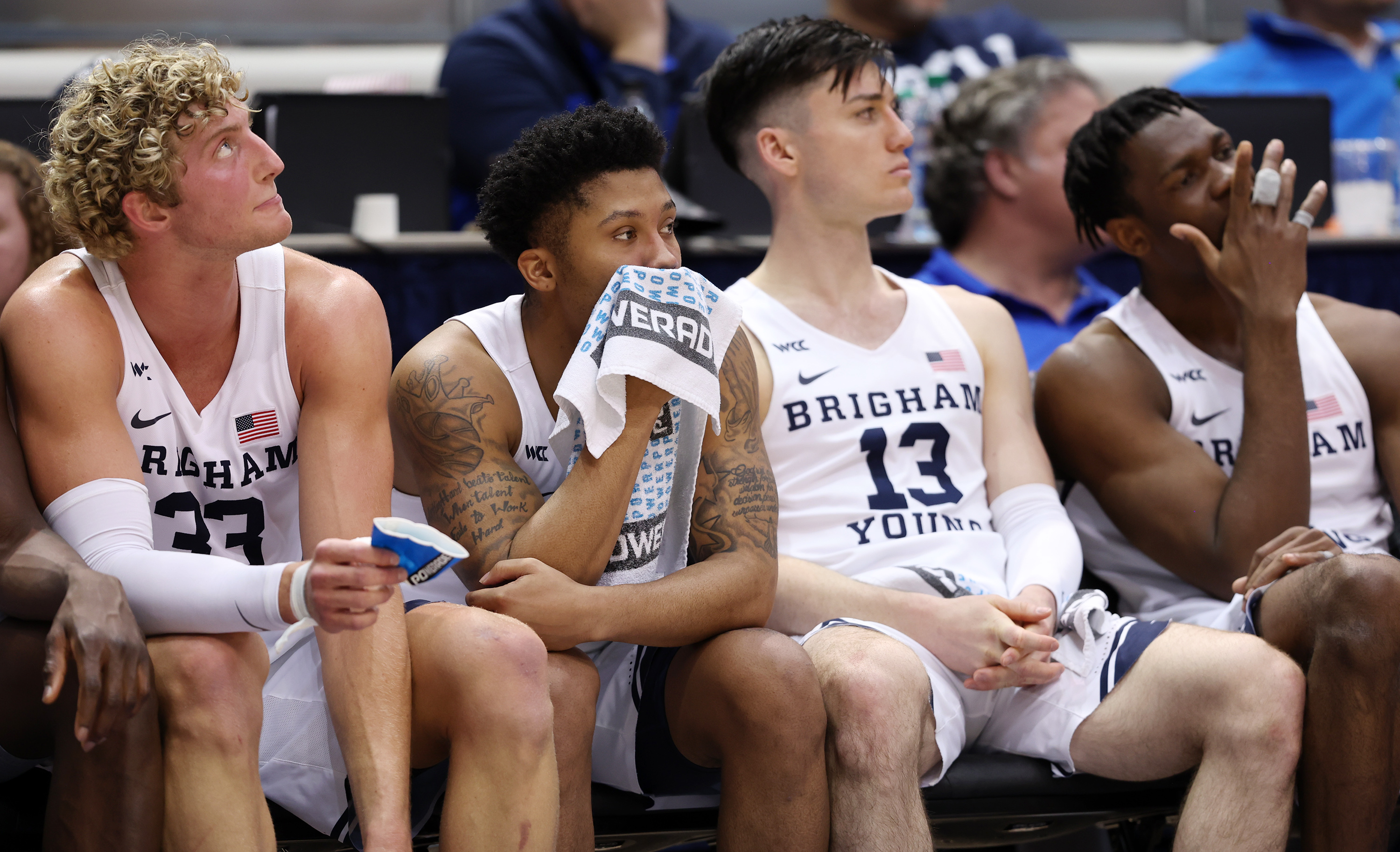 Brigham Young forward Caleb Lohner (33), Brigham Young guard Te'Jon Lucas (3), Brigham Young guard Alex Barcello (13) and Brigham Young forward Atiki Ally Atiki (4) watch from the bench as the last few moments of the game tick away as the BYU Cougars fall to the Washington State Cougars in the NIT quarterfinals at the Marriott Center in Provo on Wednesday, March 23, 2022. Washington State won 77-58.