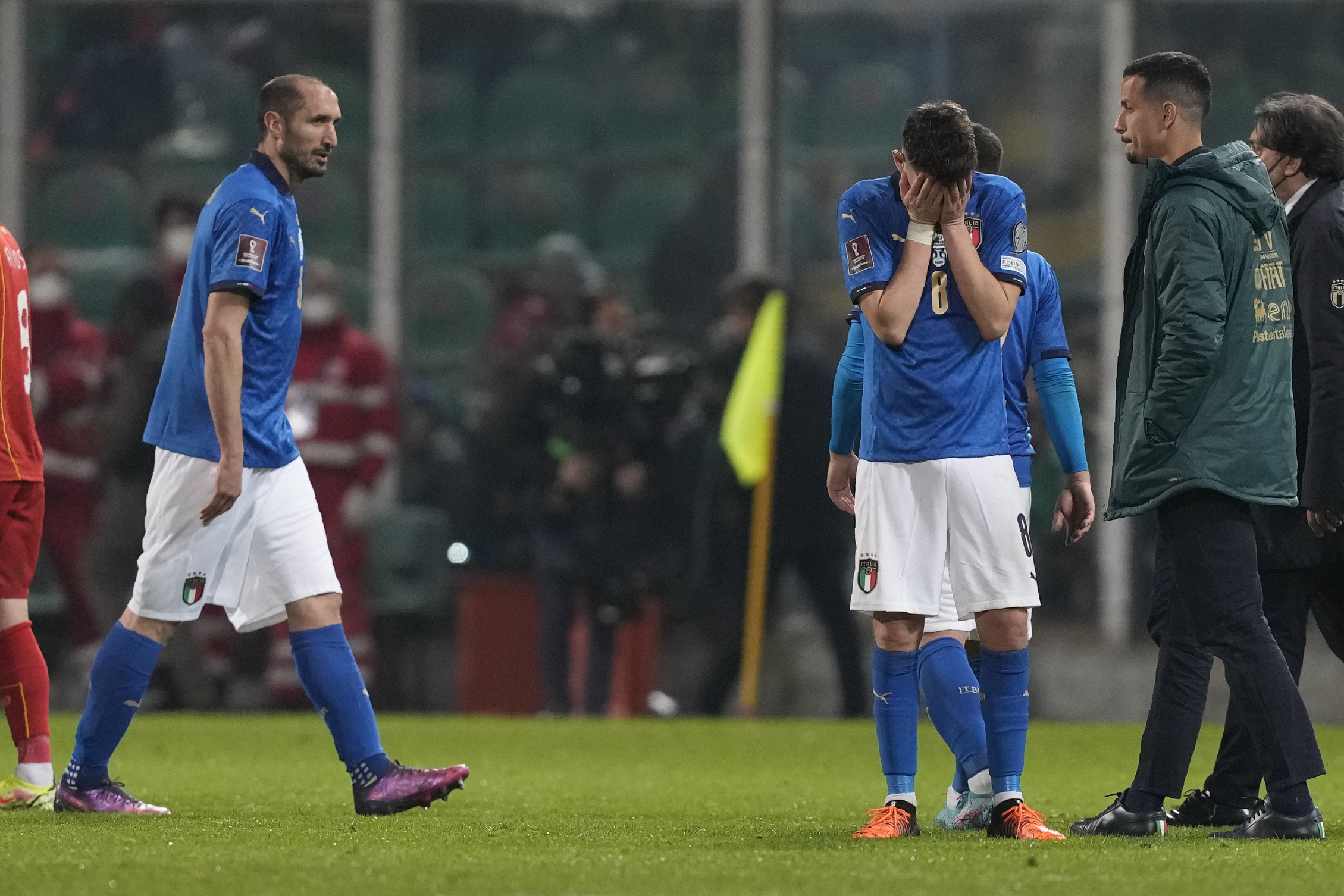 Italy's Jorginho, right, cries as his teammate walks after their team's got eliminated in the World Cup qualifying play-offsoccer match between Italy and North Macedonia, at Renzo Barbera stadium, in Palermo, Italy, Thursday, March 24, 2022. North Macedonia won 1-0. 