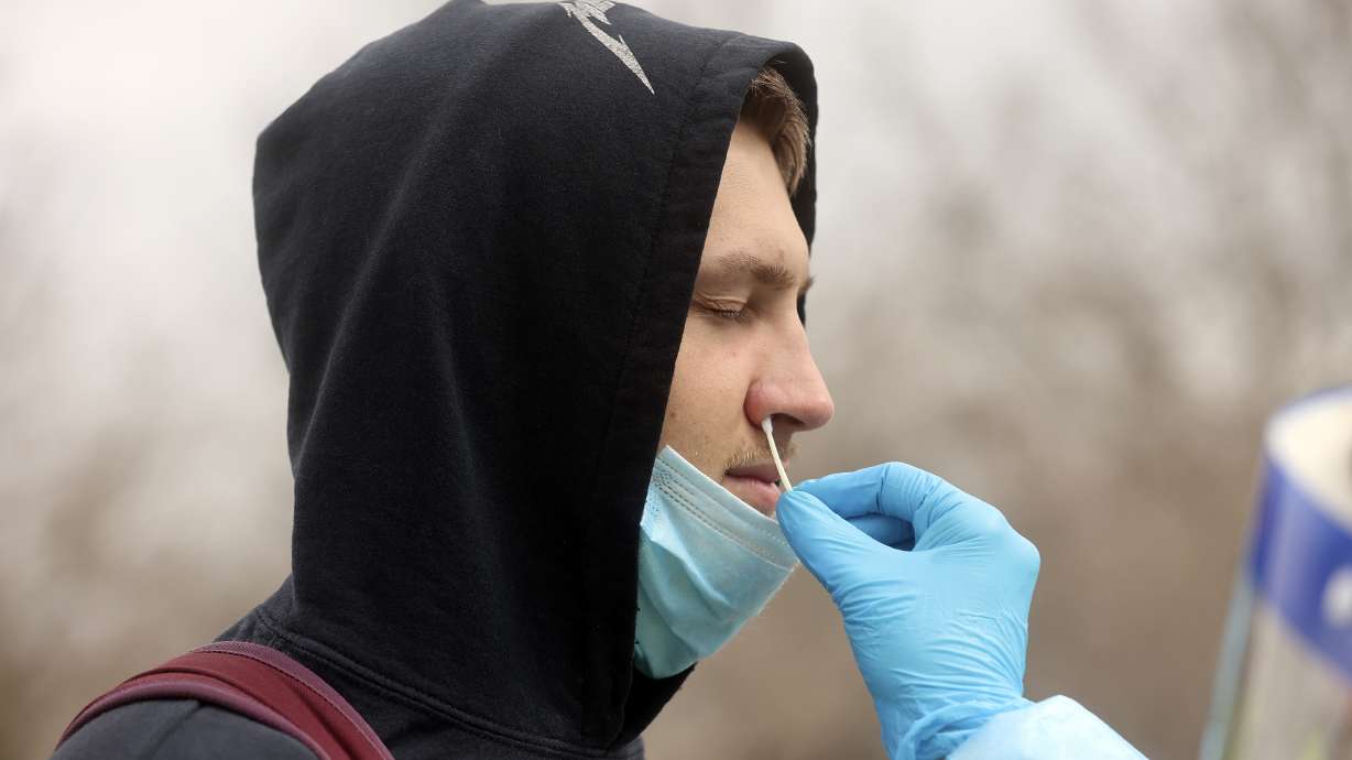 Mason Stoup gets tested for COVID-19 at a Nomi Health testing site outside of the Utah Department of Health building in Salt Lake City on Wednesday, March 16. Thursday, the state reported more than 6,500 new cases over the past week.