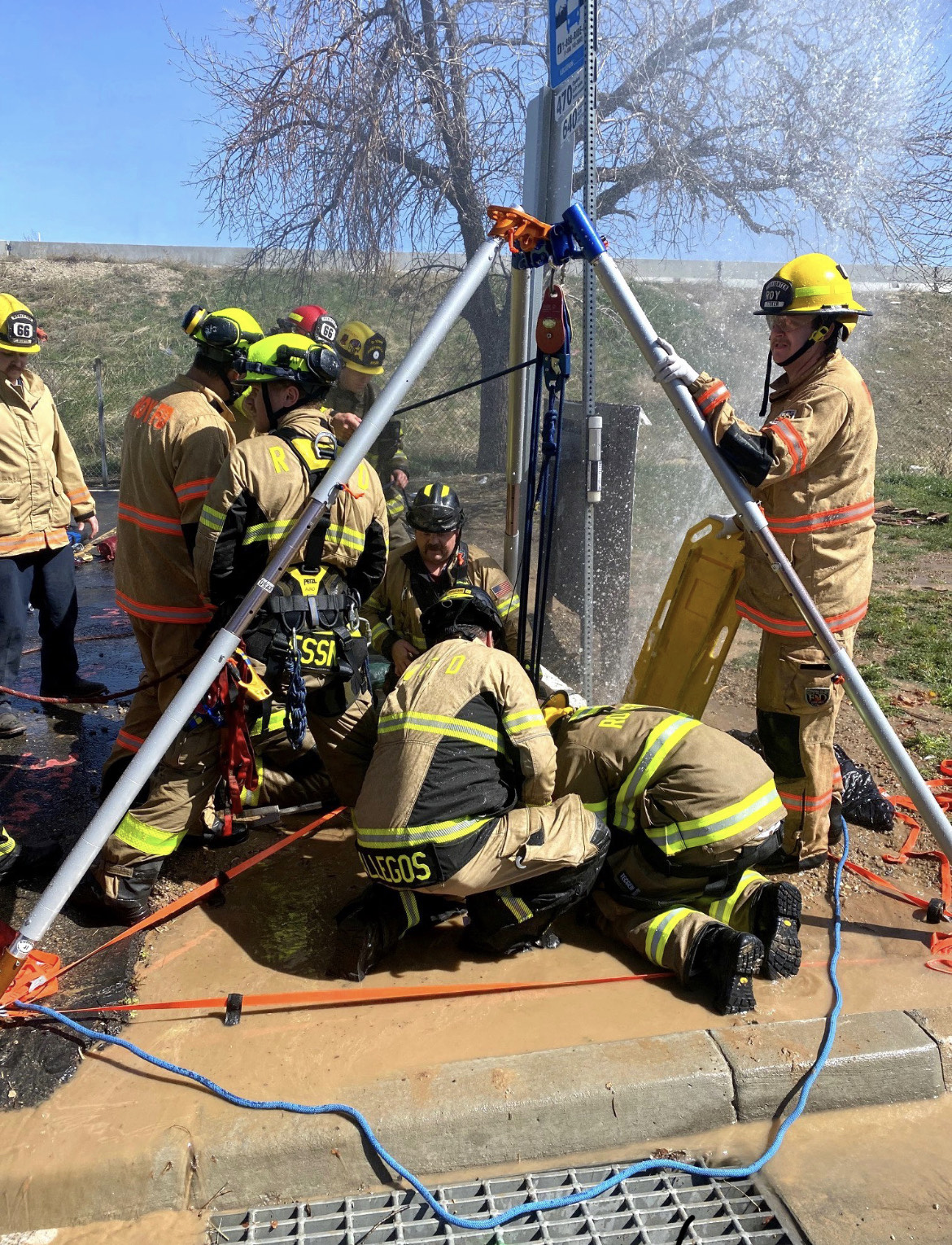 Fire crews work to rescue a woman who fell into a manhole and became trapped Friday afternoon near 1900 West and 6000 South in Roy. She was eventually freed and transported to a hospital with minor injuries.