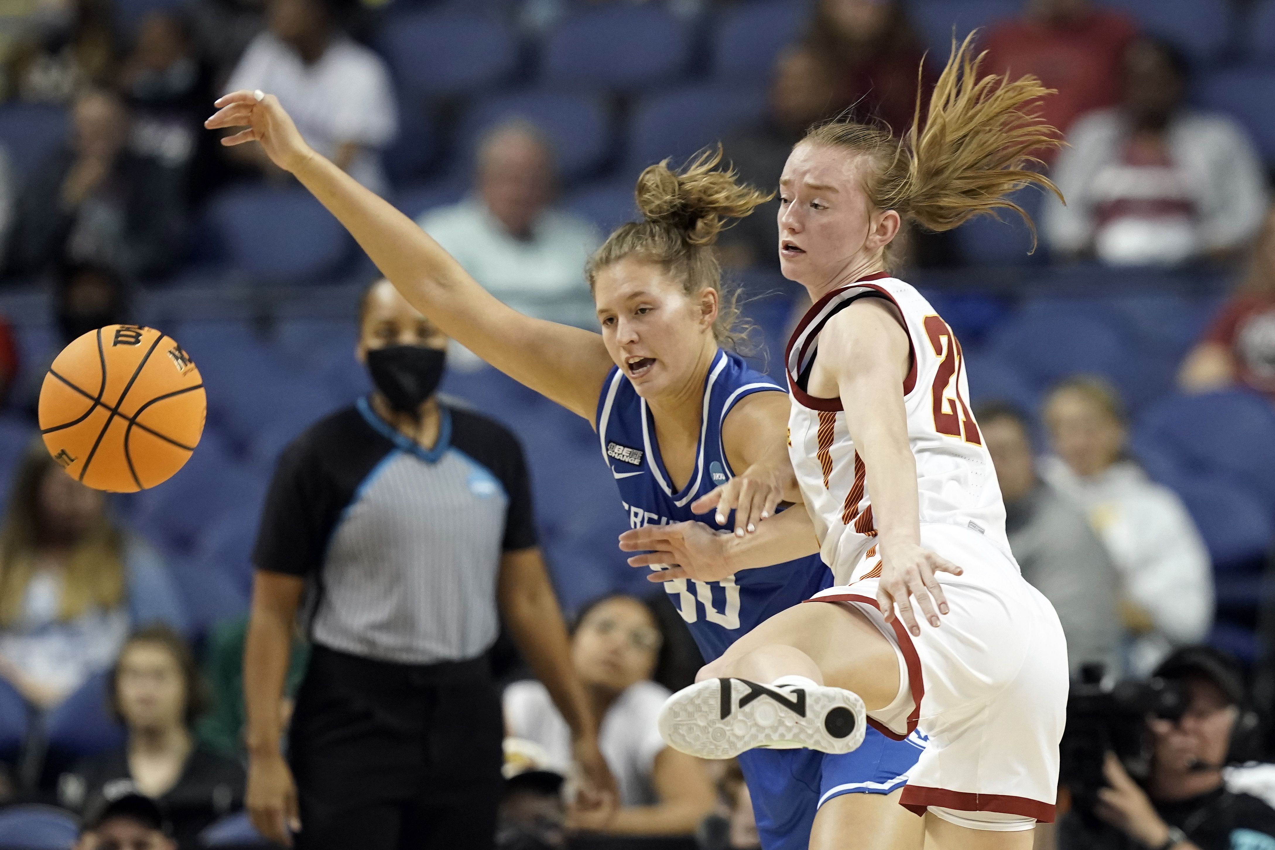 Creighton guard Morgan Maly, left, and Iowa State guard Lexi Donarski (21) chase the ball during the first half of a college basketball game in the Sweet 16 round of the NCAA women's tournament in Greensboro, N.C., Friday, March 25, 2022. 