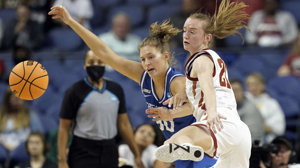 Creighton guard Morgan Maly, left, and Iowa State guard Lexi Donarski (21) chase the ball during the first half of a college basketball game in the Sweet 16 round of the NCAA women's tournament in Greensboro, N.C., Friday, March 25, 2022.