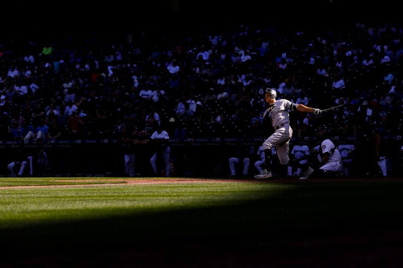 FILE PHOTO: Aug 28, 2019; Seattle, WA, USA; New York Yankees right fielder Aaron Judge (99) hits a double against the Seattle Mariners during the ninth inning at T-Mobile Park.