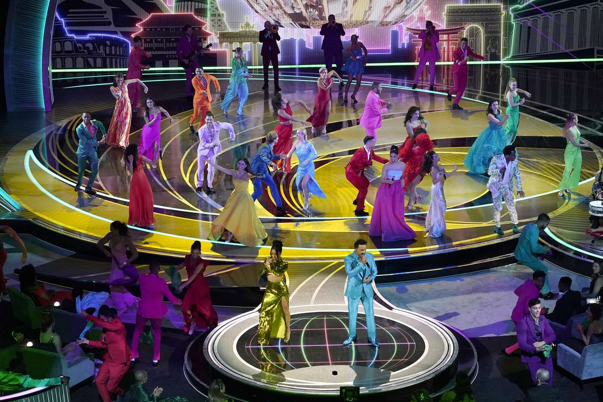 Becky G, left, and Luis Fonsi perform "We Don't Talk About Bruno" from "Encanto" at the Oscars on Sunday, at the Dolby Theatre in Los Angeles.