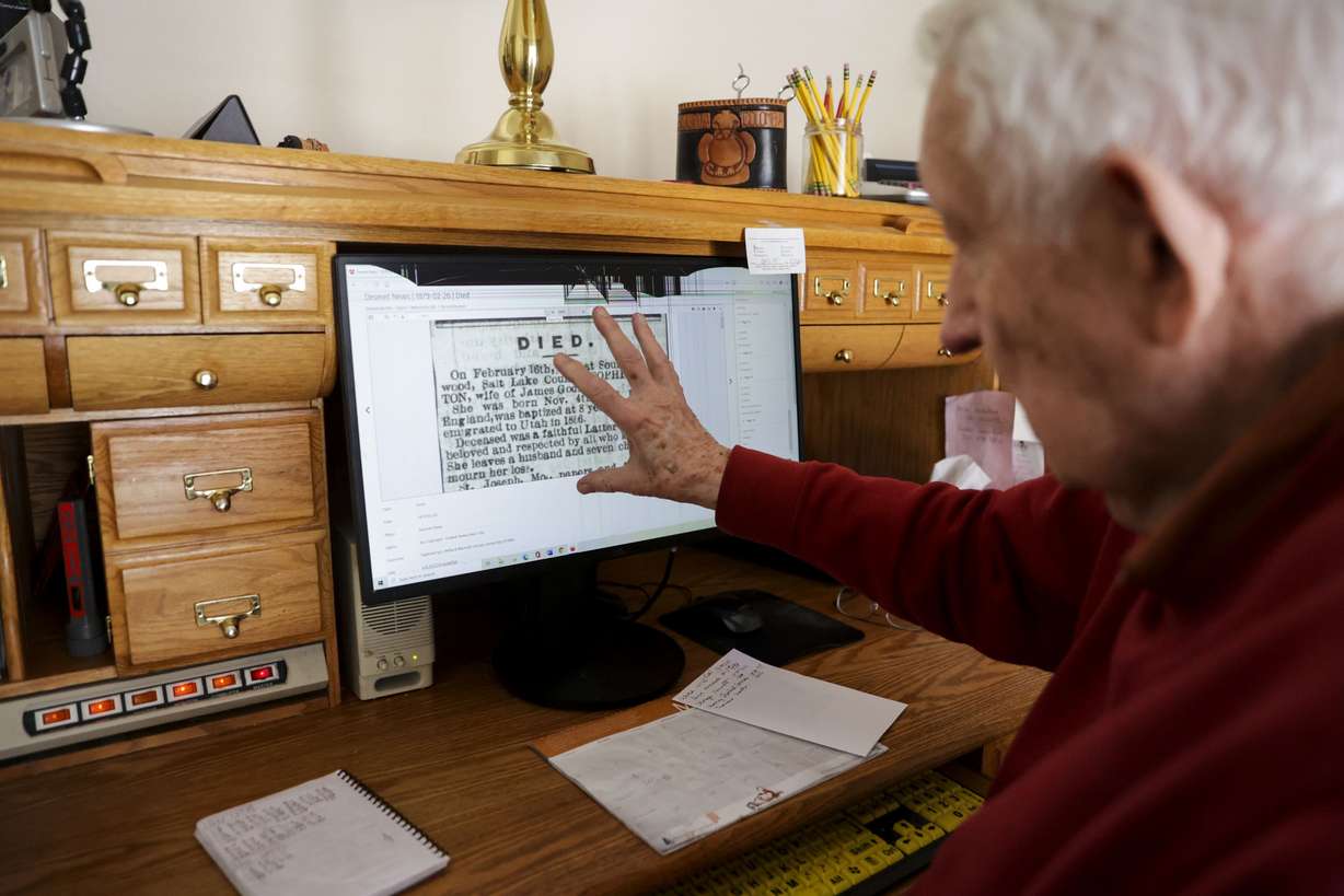 Dale Adams explains how he screenshots obituary sections to update the information on FamilySearch at his house in Park City on March 14.