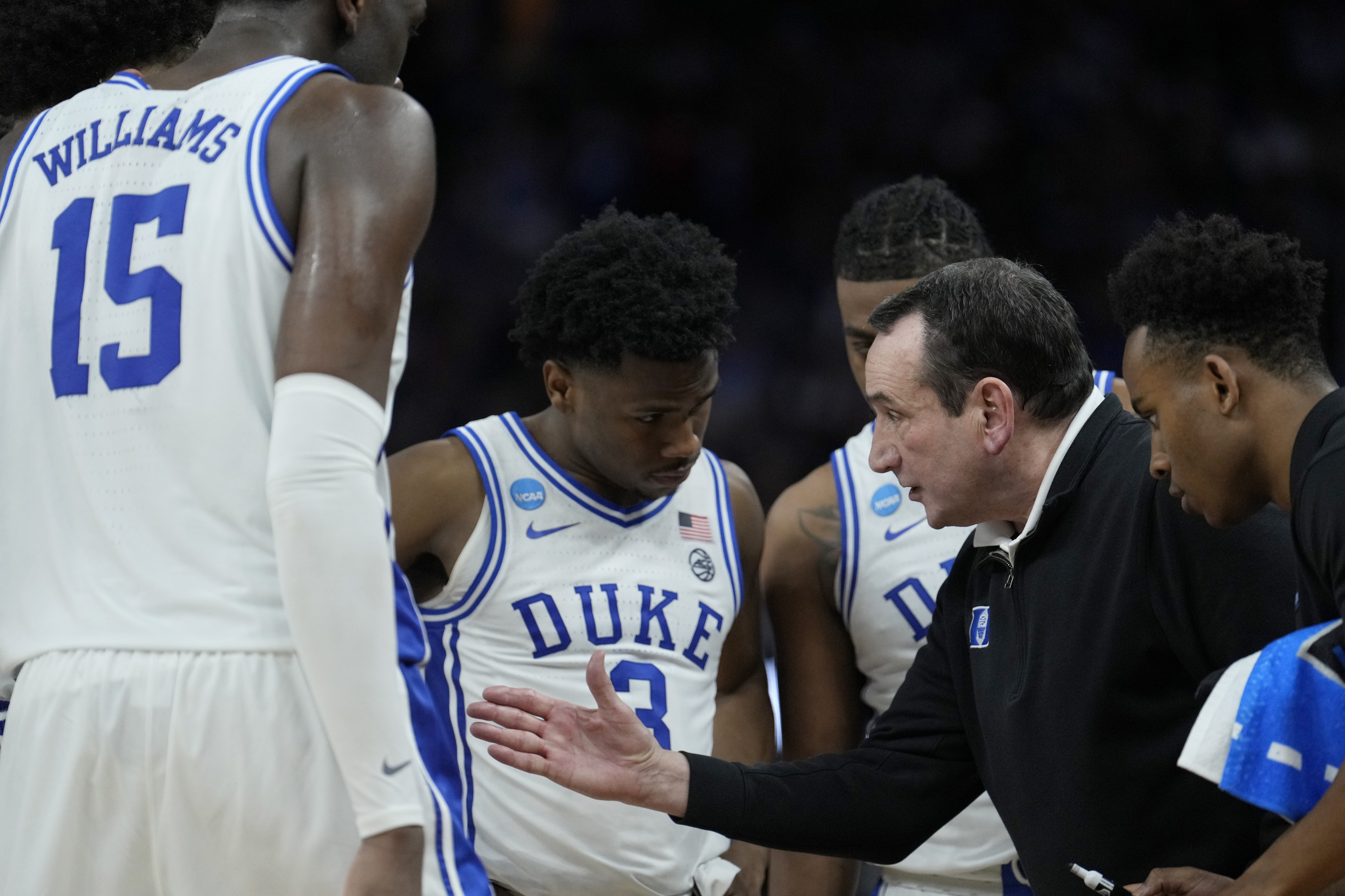 Duke head coach Mike Krzyzewski, second from right, huddles with players during the second half of a college basketball game against Arkansas in the Elite 8 round of the NCAA men's tournament in San Francisco, Saturday, March 26, 2022. 