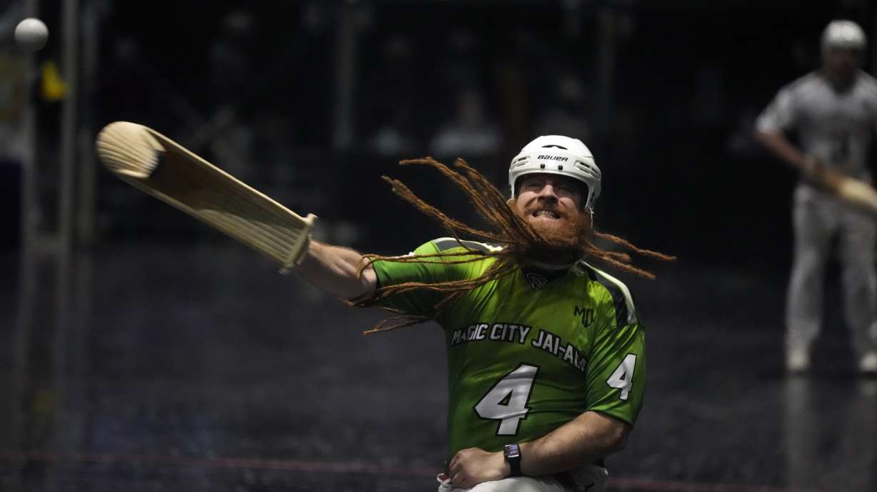 Dennis Dalton, known by the moniker "El Barba," Spanish for "The Beard," competes in a doubles Jai Alai match in the fronton at Magic City Casino, Sunday, March 13, 2022, in Miami. What could be Jai Alai's last stand is taking place at Magic City Casino, where a small group of committed enthusiasts are doing all they can to save the game that originated in the Basque region of Spain and France but took root in Miami during the go-go days of of the 1970s and 1980s.