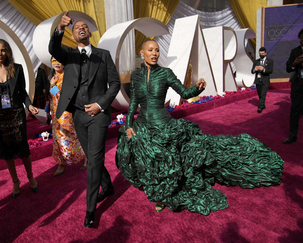 Will Smith, left, and Jada Pinkett Smith arrive at the Oscars on Sunday at the Dolby Theatre in Los Angeles.