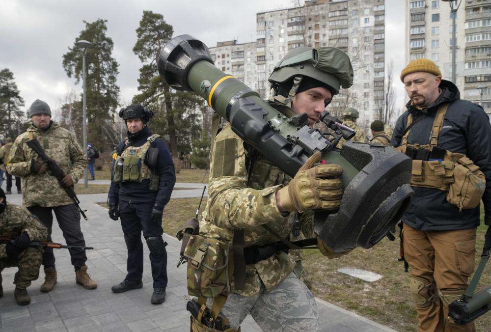 A Ukrainian Territorial Defense Forces member holds an NLAW anti-tank weapon, in the outskirts of Kyiv, Ukraine, on March 9. Ukrainian authorities said Saturday that they cannot trust statements from the Russian military, suggesting the Kremlin planned to concentrate its remaining strength on eastern regions.