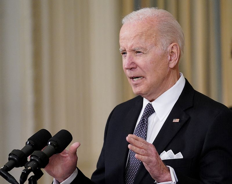U.S. President Joe Biden announces his budget proposal for fiscal year 2023, as Office of Management and Budget (OMB) Director Shalanda Young listens in the State Dining Room at the White House in Washington, U.S., March 28, 2022.