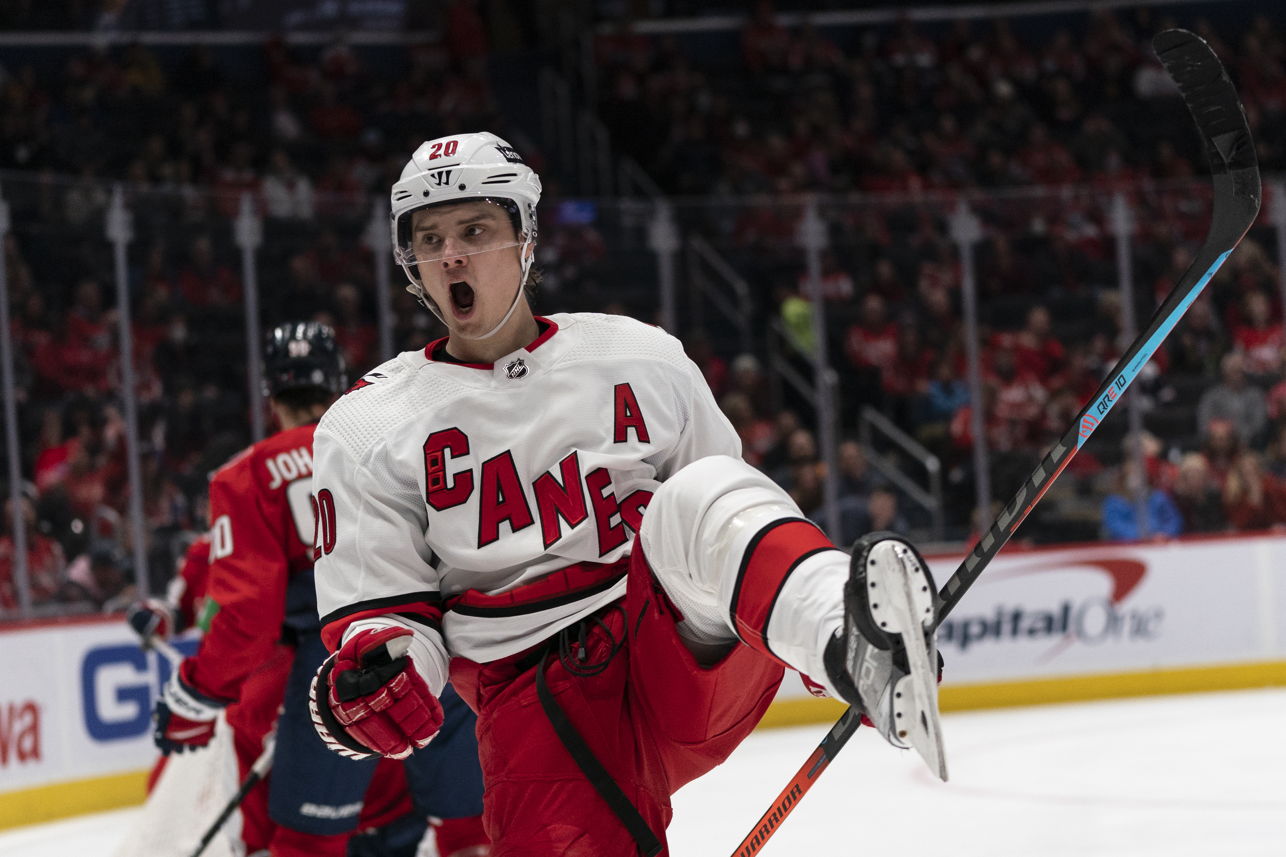 Carolina Hurricanes center Sebastian Aho (20) celebrates his goal in the second period of an NHL hockey game against the Washington Capitals, Monday, March 28, 2022, in Washington.