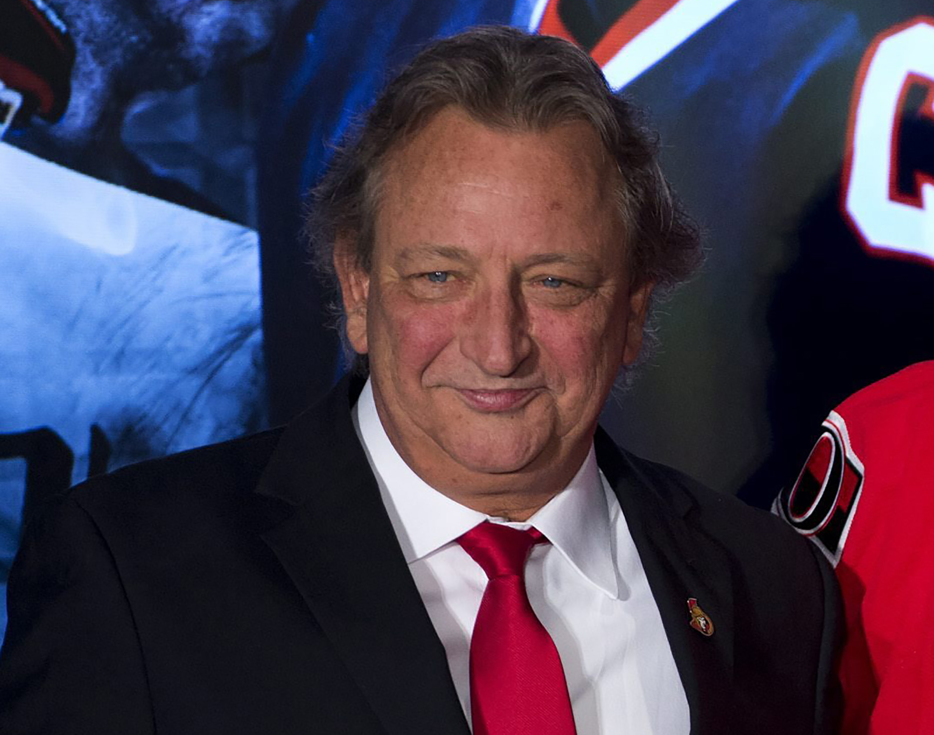 FILE - Ottawa Senators team owner Eugene Melnyk attends an NHL hockey news conference Dec. 4, 2014, in Ottawa. The Senators say Melnyk has died from an illness at age 62. The team announced the news with a statement from his family. 