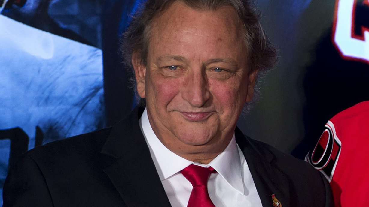 FILE - Ottawa Senators team owner Eugene Melnyk attends an NHL hockey news conference Dec. 4, 2014, in Ottawa. The Senators say Melnyk has died from an illness at age 62. The team announced the news with a statement from his family.