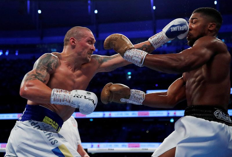 FILE PHOTO: Boxing - WBA, IBF & WBO Heavyweight Titles - Anthony Joshua v Oleksandr Usyk - Tottenham Hotspur Stadium, London, Britain - September 25, 2021 Oleksandr Usyk  in action against Anthony Joshua Action Images via Reuters/Andrew Couldridge