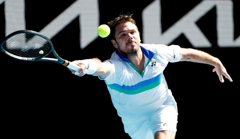 FILE PHOTO: Tennis - Australian Open - Melbourne Park, Melbourne, Australia, February 10, 2021 Switzerland's Stan Wawrinka in action during his second round match against Hungary's Marton Fucsovics