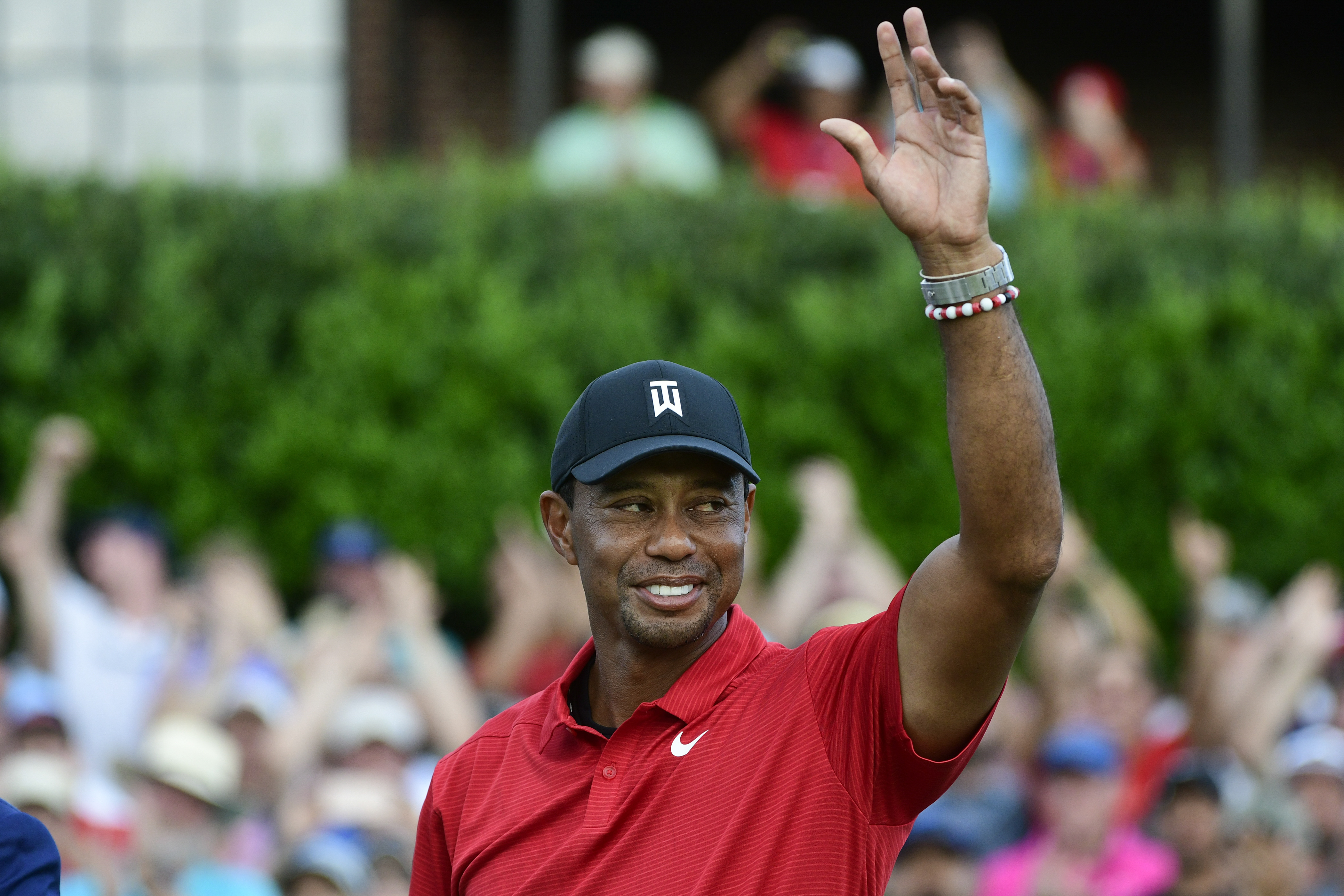 Tiger Woods celebrates on the 18th green after wining the Tour Championship golf tournament Sunday, Sept. 23, 2018, in Atlanta. Woods will be the star attraction in the World Golf Hall of Fame induction ceremony Wednesday, March 9, 2022. 
