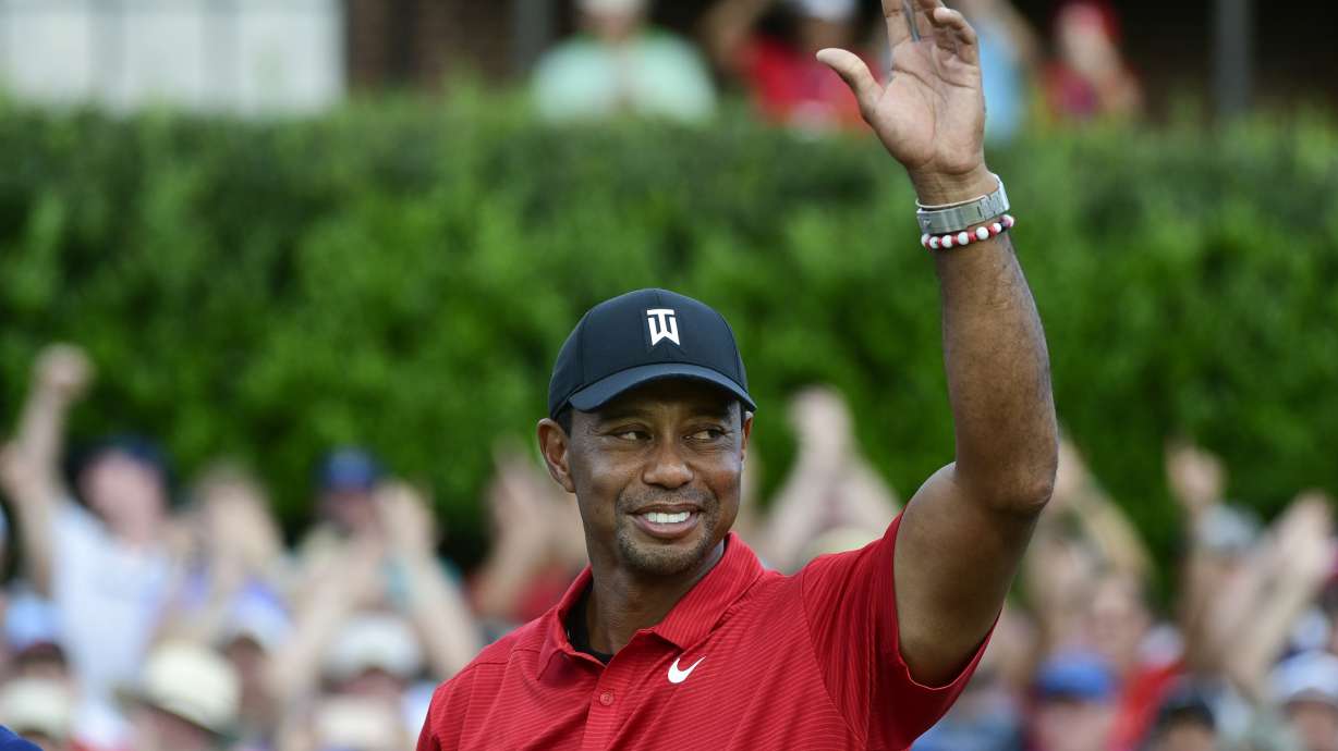 Tiger Woods celebrates on the 18th green after wining the Tour Championship golf tournament Sunday, Sept. 23, 2018, in Atlanta. Woods will be the star attraction in the World Golf Hall of Fame induction ceremony Wednesday, March 9, 2022.