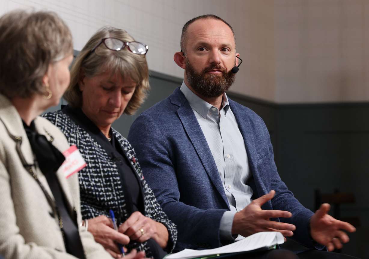 Logan Mayor Holly H. Daines, left, and Utah State University President Noelle E. Cockett, center, listen to Sam Malouf, co-founder CEO of Malouf Companies and president of the Malouf Foundation, during a community forum with Logan residents, business owners and leaders in Logan on March 29. The forum was presented by the Deseret News and Malouf Companies.