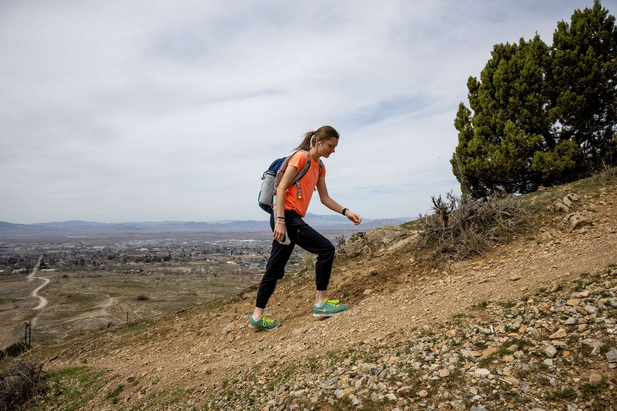 Makayla Hill hikes on a trail above North Logan on March 26.