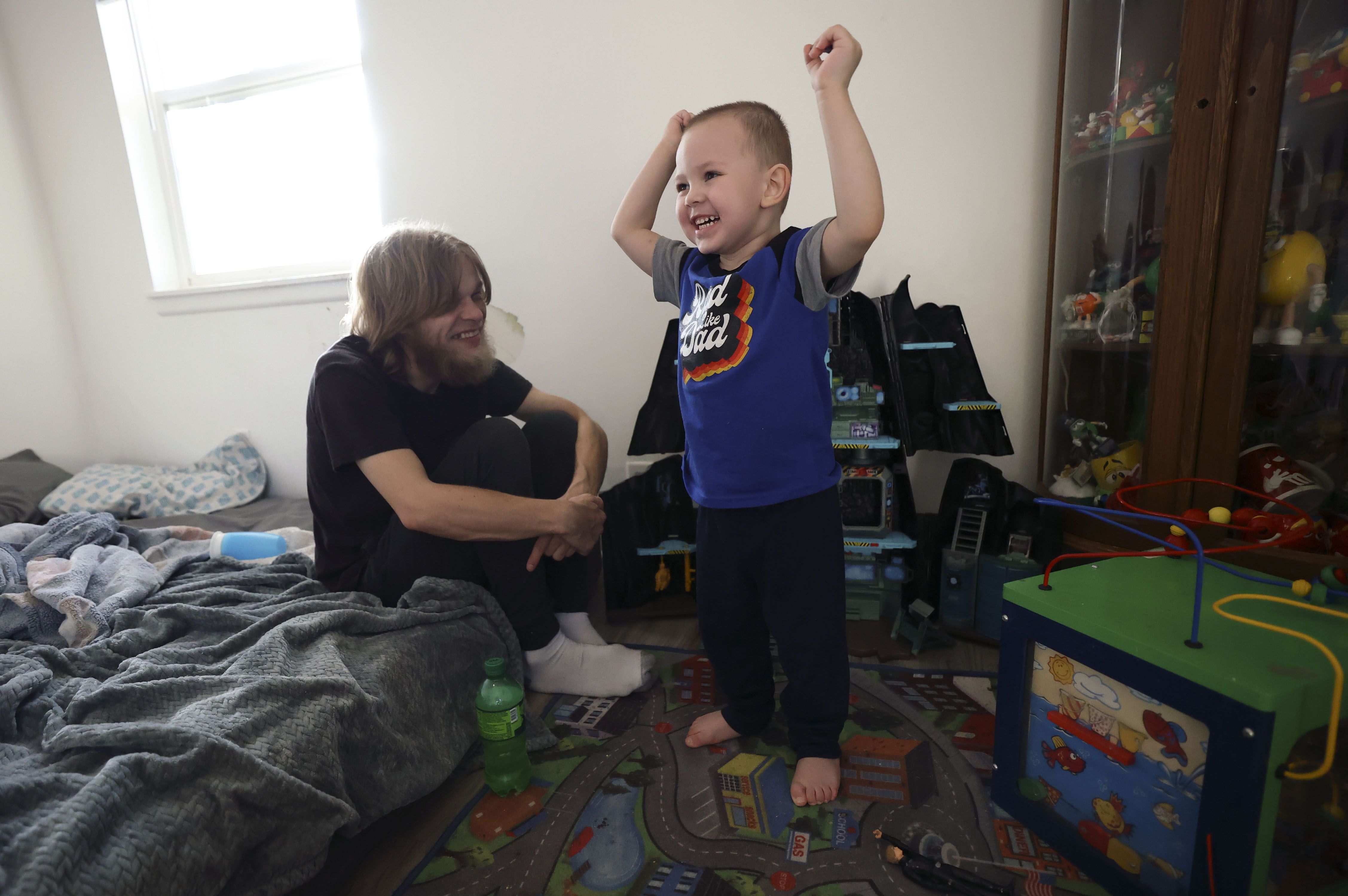Justin Francis Sr. plays with his son, Justin Lee Francis, 3, at their home in Salt Lake City on Feb. 11. Justin Lee Francis is still recovering from COVID-19 after being intubated at Primary Children’s Hospital.