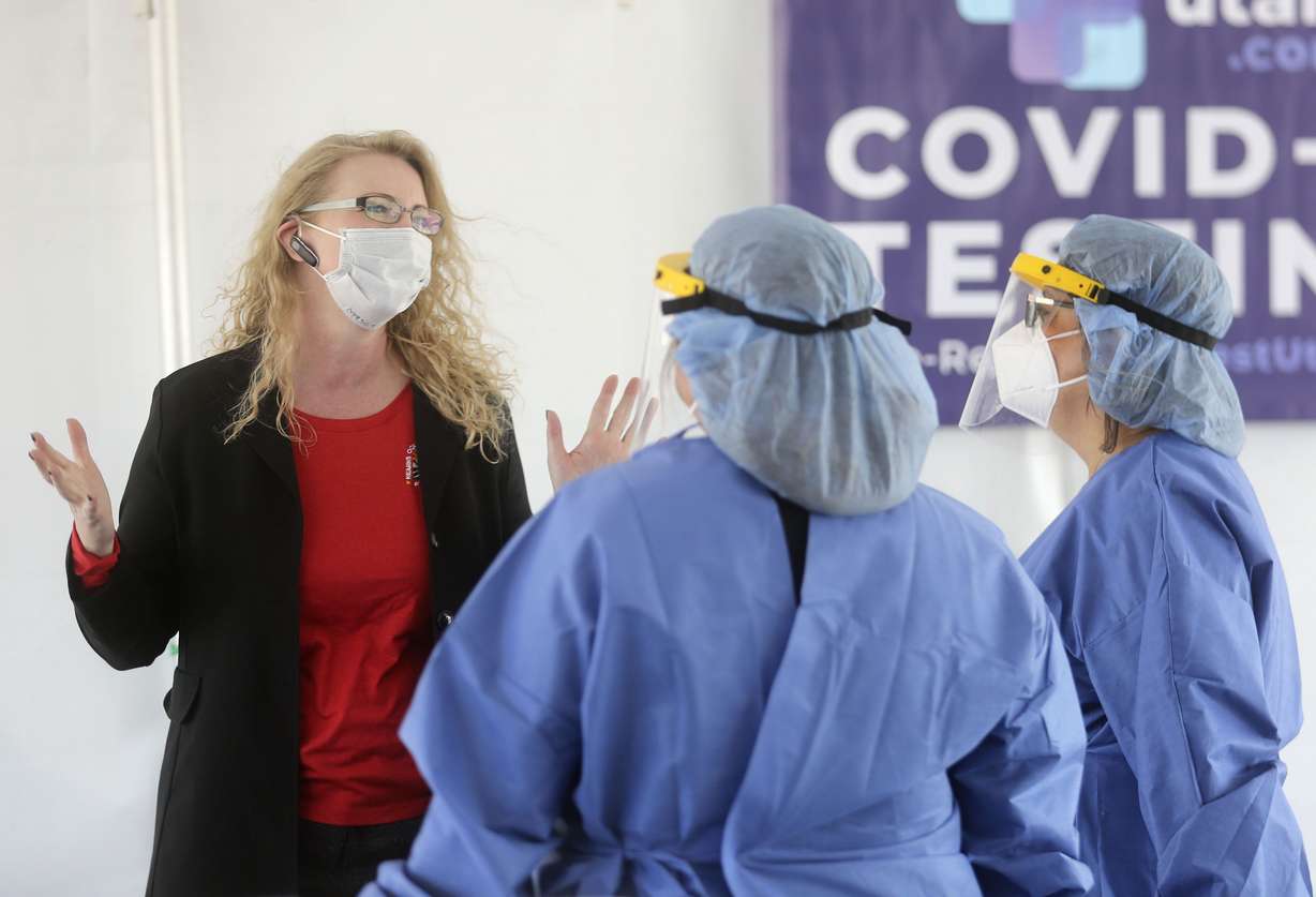 Salt Lake County Councilwoman Laurie Stringham, then chairwoman at the Kearns Oquirrh Park Fitness Center, talks to nurses as they wait to test people for COVID-19 at a TestUtah free testing site outside of the Kearns Recreation Center at Oquirrh Park in Kearns on July 8, 2020.
