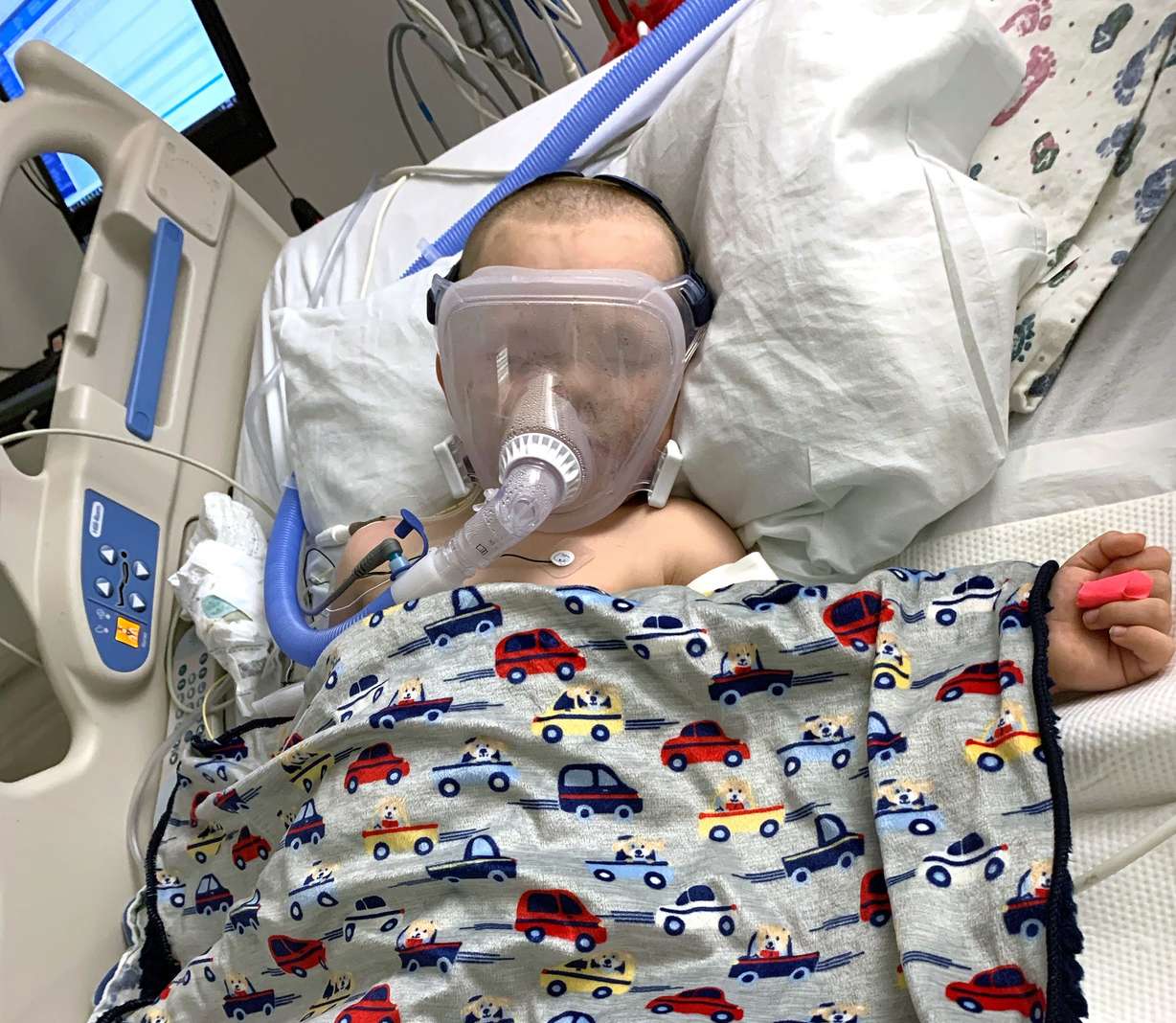 Three-year-old Justin Lee Francis sleeps as he wears a CPAP/BiPAP mask while battling COVID-19 at Primary Children’s Hospital in Salt Lake City on Jan. 22.