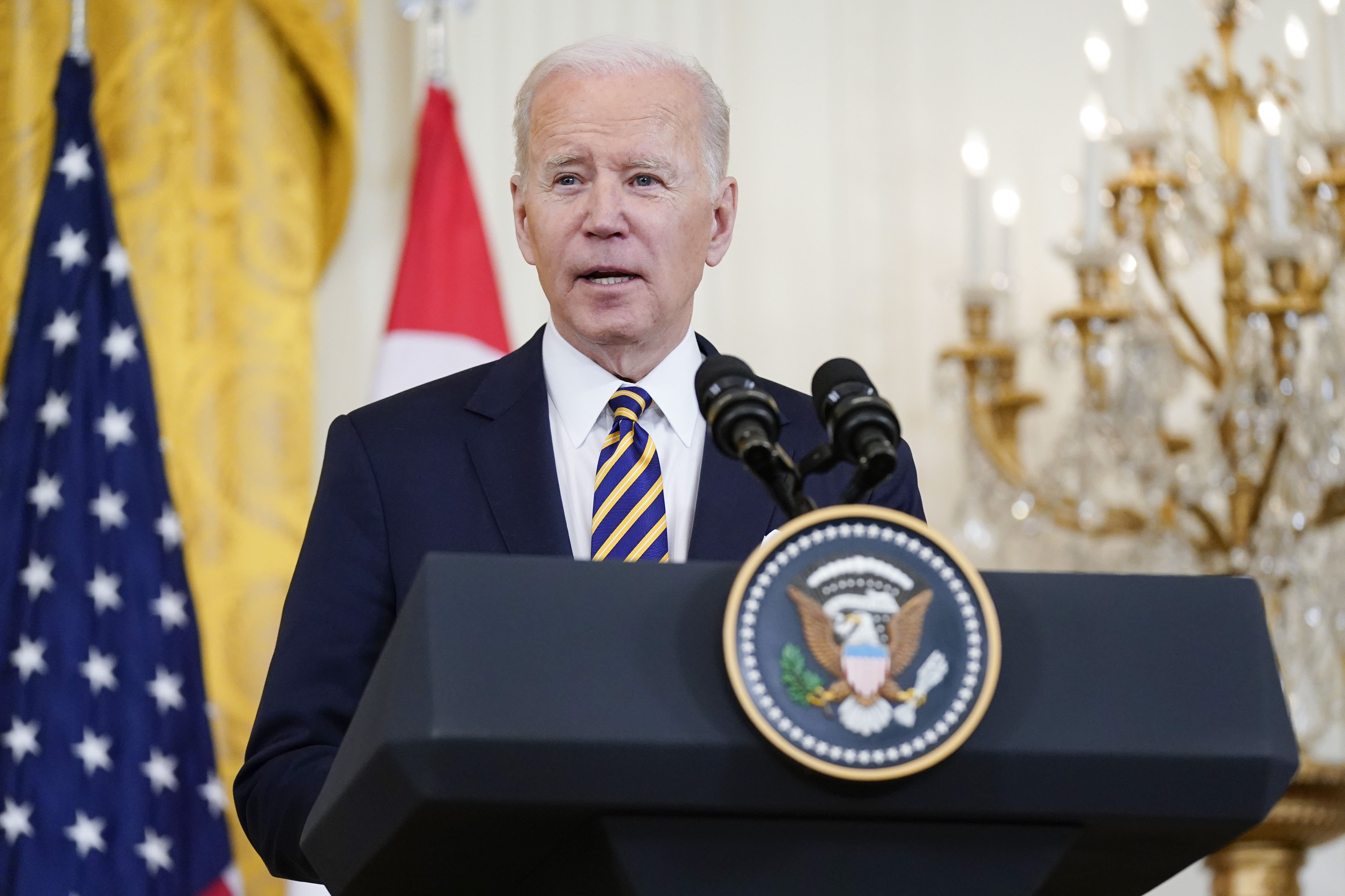 President Joe Biden speaks alongside Singapore's Prime Minister Lee Hsien Loong in the East Room of the White House, Tuesday in Washington. The Biden administration is launching what it says is a one-stop website that will help people in the United States access COVID-19 tests, vaccines and treatments, along with status updates on infection rates where they live. 