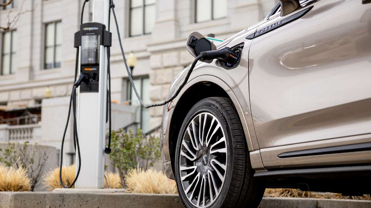 An electric vehicle charges at a charging station at the Capitol in Salt Lake City on Tuesday.