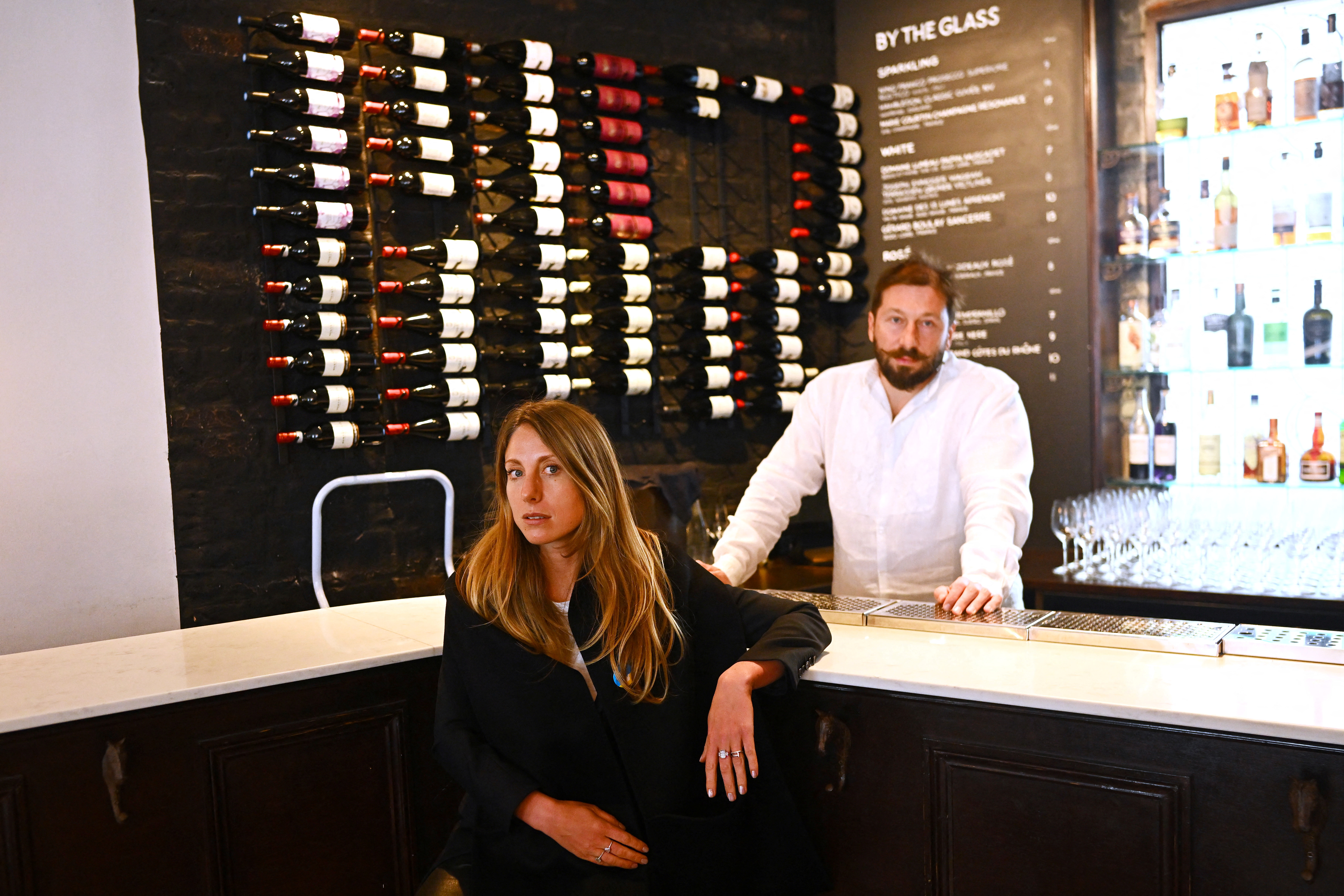 Tatiana Fokina and her husband Yevgeny Chichvarkin are seen in their Mayfair bar in London, Britain, March 23. A growing number of Russians living abroad are finding issues accessing their money, and are unable to donate to pro-Ukrainian causes, even when they are not the direct targets of Western sanctions.