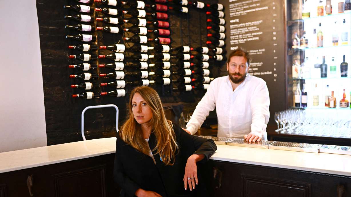 Tatiana Fokina and her husband Yevgeny Chichvarkin are seen in their Mayfair bar in London, Britain, March 23. A growing number of Russians living abroad are finding issues accessing their money, and are unable to donate to pro-Ukrainian causes, even when they are not the direct targets of Western sanctions.
