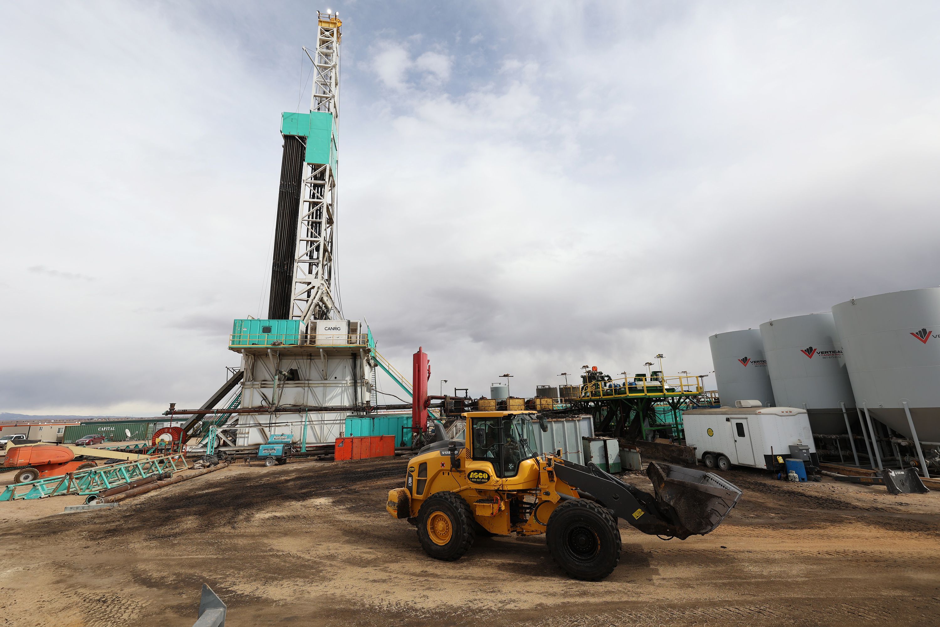 A worker operates a loader around the pad as a rig drills a well near Roosevelt on Sunday, March 13. Citing more than 4,600 oil and gas permits he says are languishing under the purview of the Interior Department, Rep. Blake Moore, R-Utah, introduced legislation Wednesday to hold the agency accountable. 