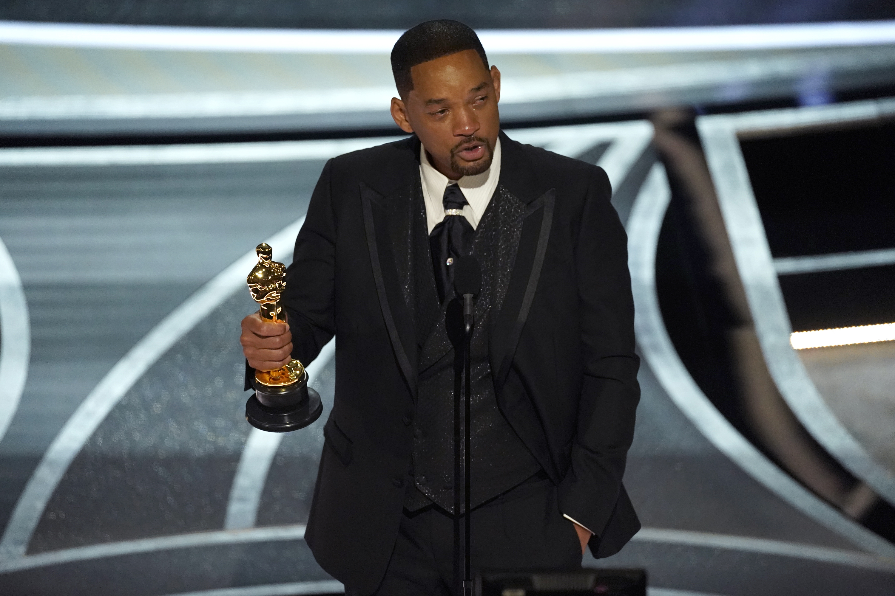 Will Smith cries as he accepts the award for best performance by an actor in a leading role for "King Richard" at the Oscars on Sunday, at the Dolby Theatre in Los Angeles.
